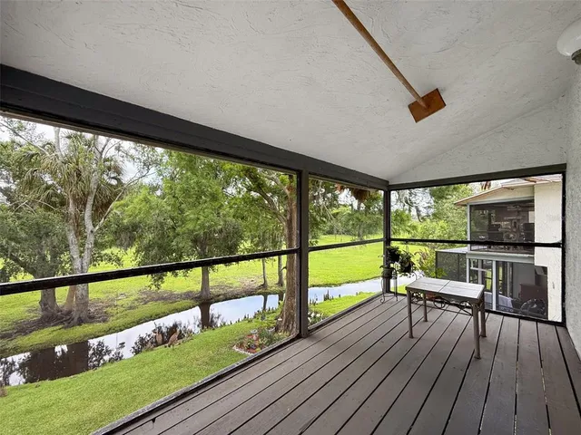 a view of a balcony with wooden floor