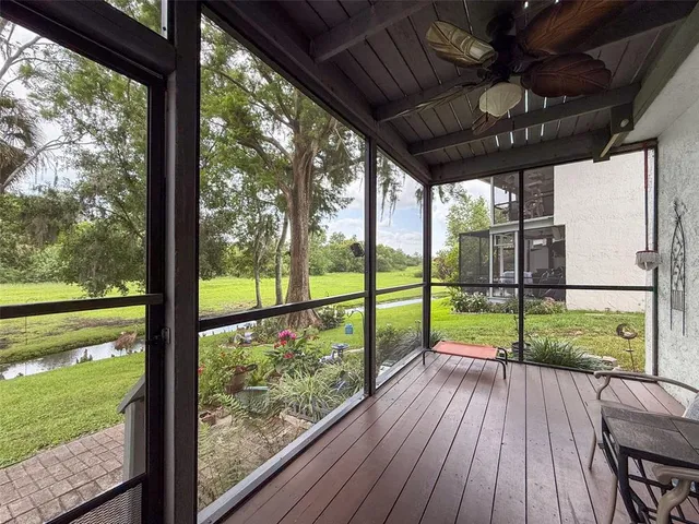 a view of a house with porch and garden