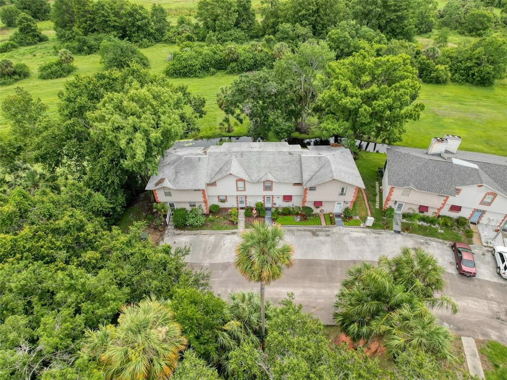 7135 Trenton Place New Port Richey, FL 34653 - Photo 48 of 50 an aerial view of a house with yard swimming pool and outdoor seating