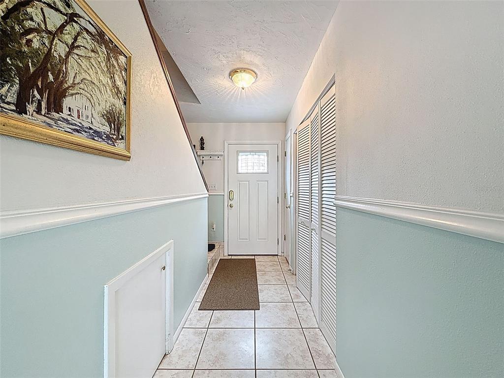 7135 Trenton Place New Port Richey, FL 34653 - Photo 6 of 50 a view of a hallway view with staircase