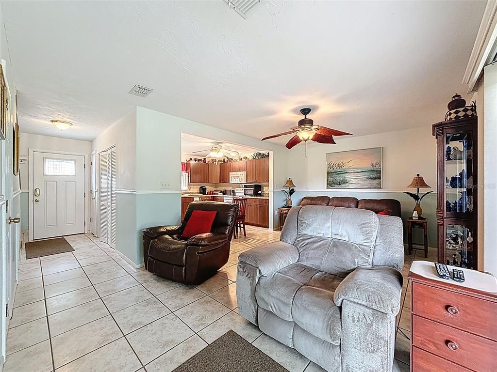 7135 Trenton Place New Port Richey, FL 34653 - Photo 7 of 50 a living room with furniture and a flat screen tv