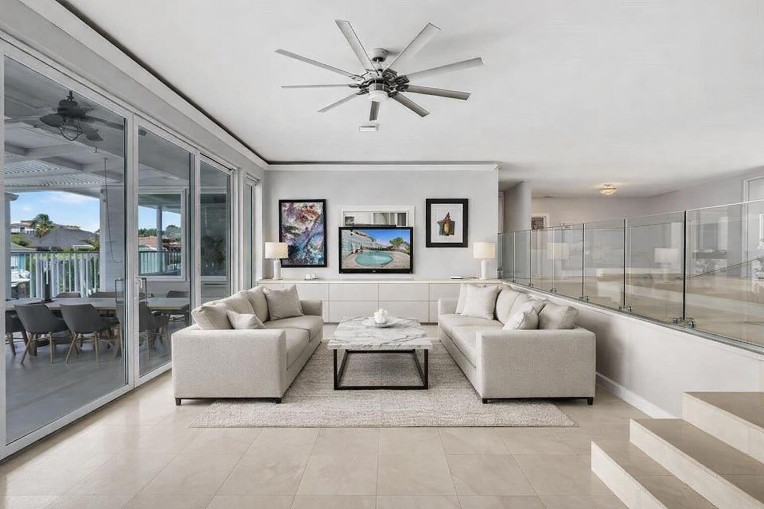 3001 Northeast 47th Street Lighthouse Point, FL 33064 - Photo 11 of 39 a living room with furniture and a large window