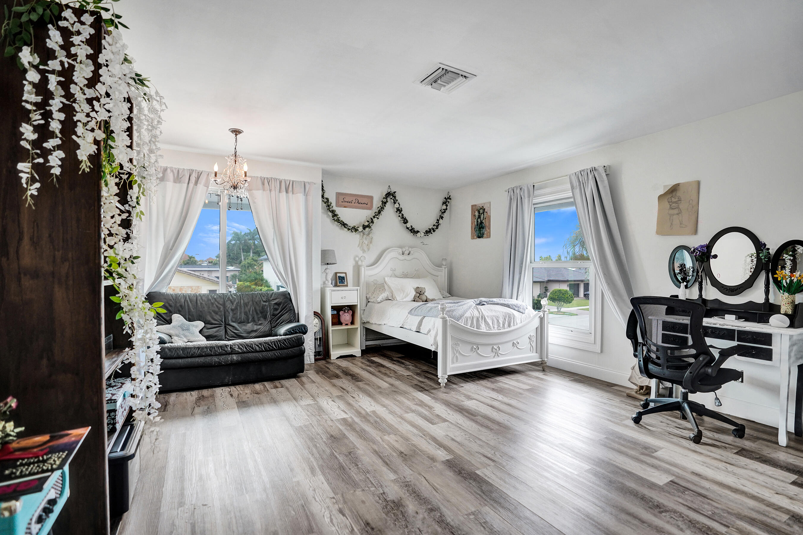 3001 Northeast 47th Street Lighthouse Point, FL 33064 - Photo 20 of 39 a bedroom with furniture and a wooden floor