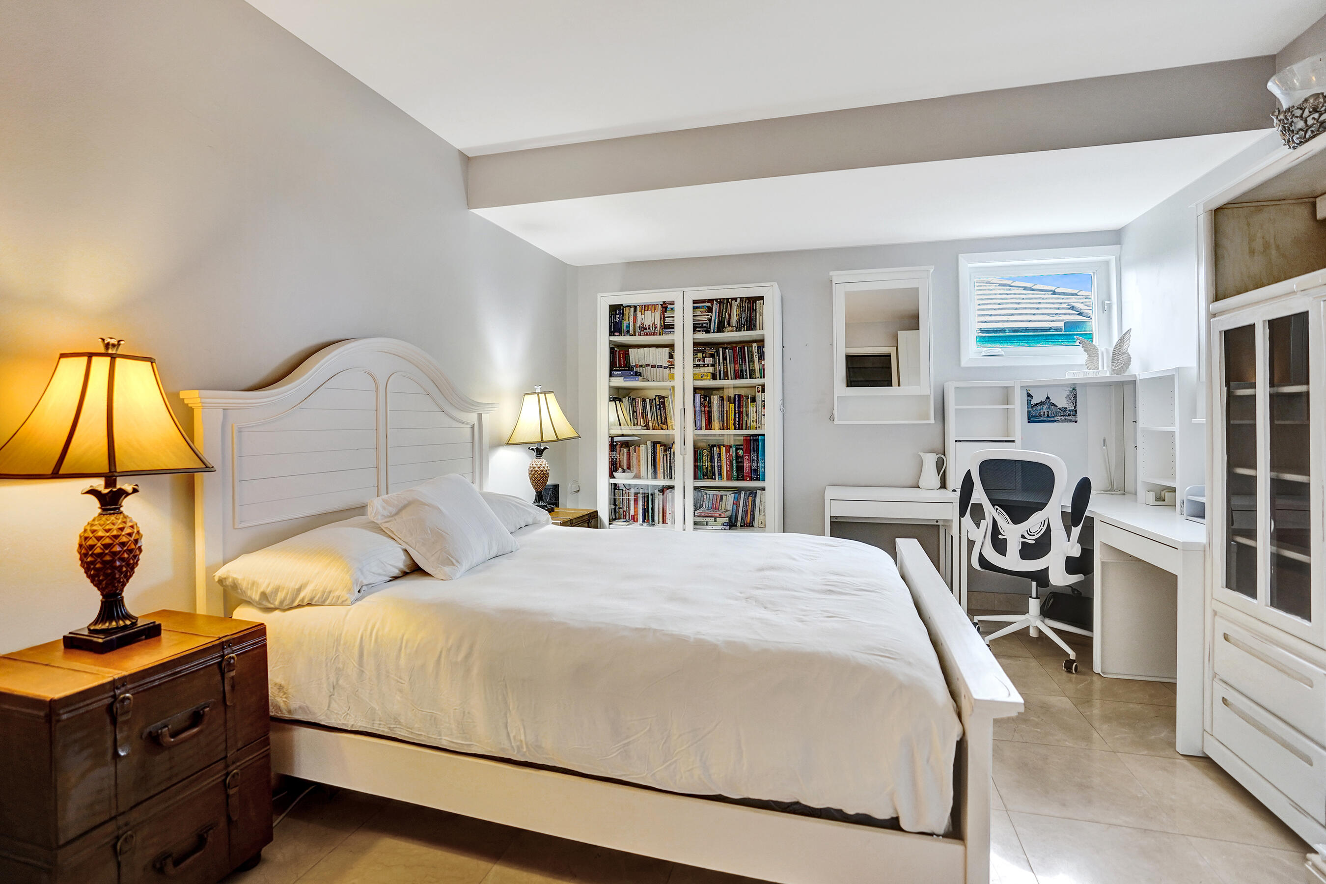 3001 Northeast 47th Street Lighthouse Point, FL 33064 - Photo 23 of 39 a bedroom with a bed and a flat screen tv