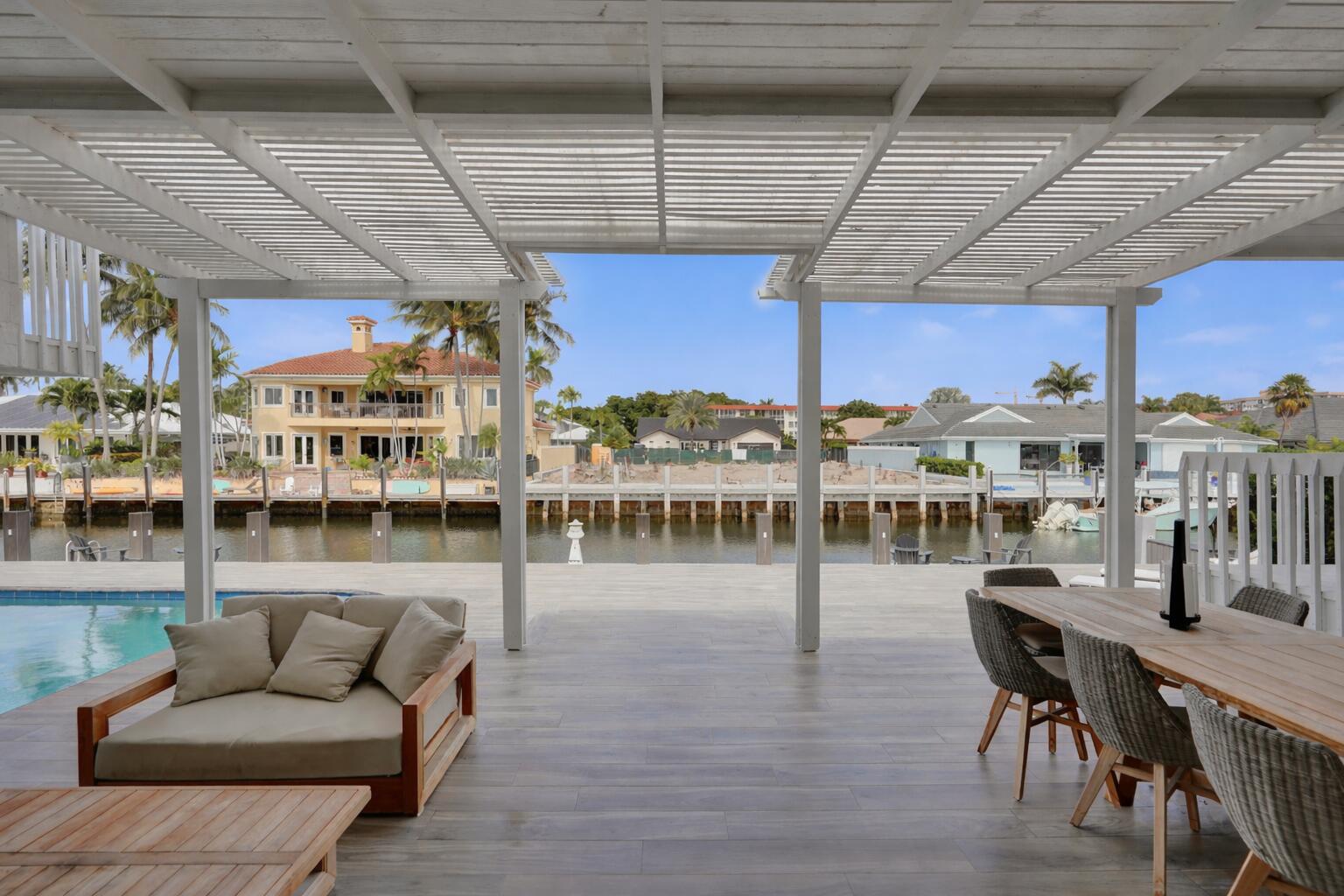 3001 Northeast 47th Street Lighthouse Point, FL 33064 - Photo 27 of 39 a dining room with wooden floor and pool table