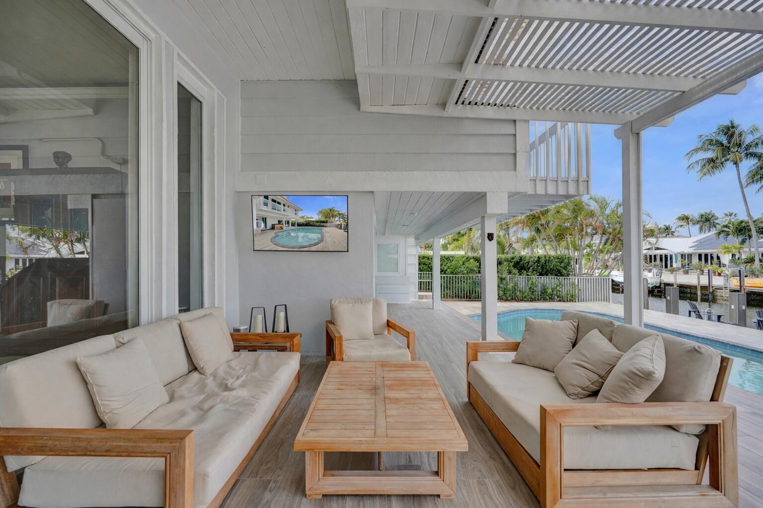 3001 Northeast 47th Street Lighthouse Point, FL 33064 - Photo 28 of 39 a living room with furniture and a large window