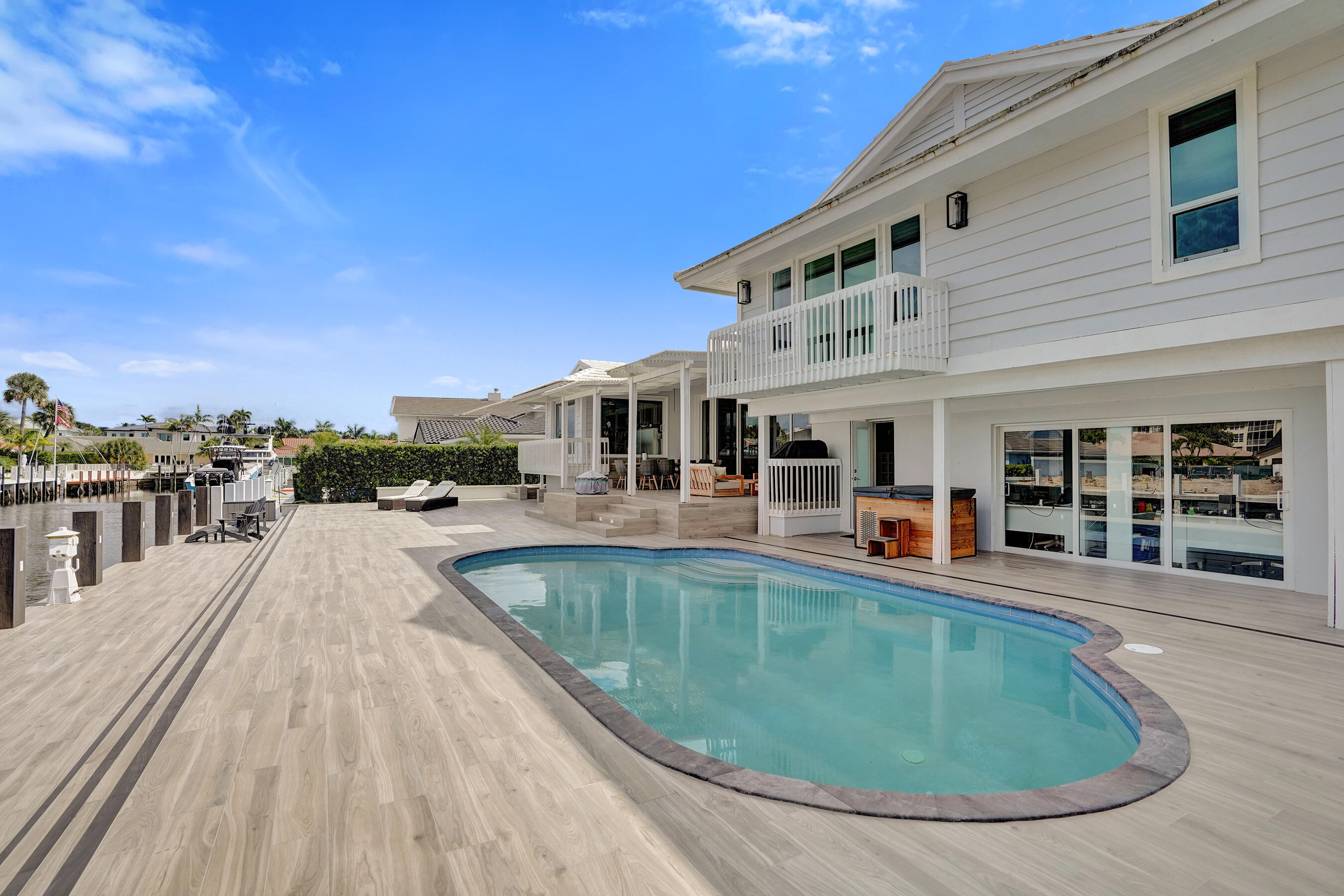 3001 Northeast 47th Street Lighthouse Point, FL 33064 - Photo 29 of 39 a view of a house with pool fire pit and chairs