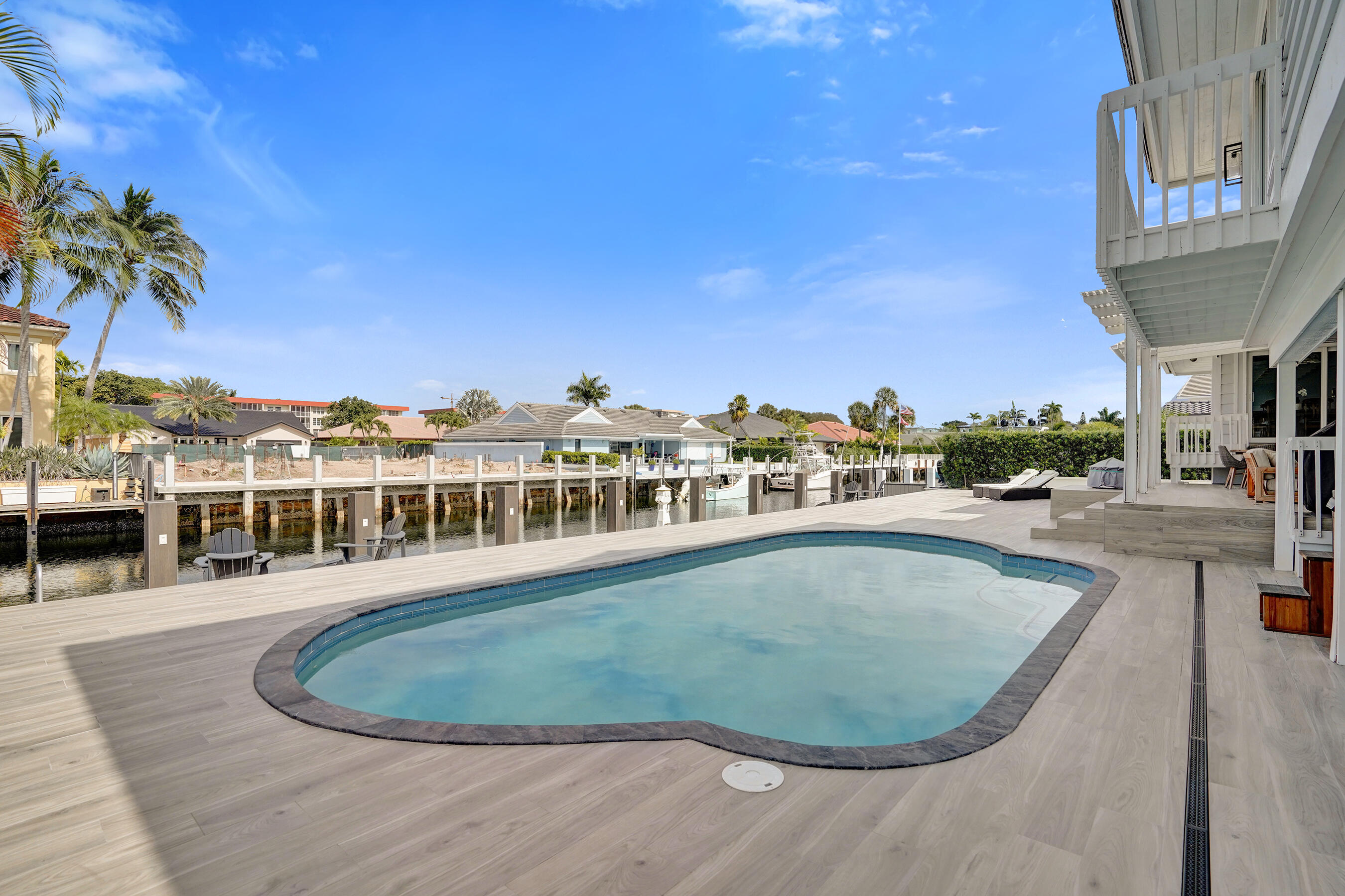 3001 Northeast 47th Street Lighthouse Point, FL 33064 - Photo 30 of 39 a view of a swimming pool and a terrace
