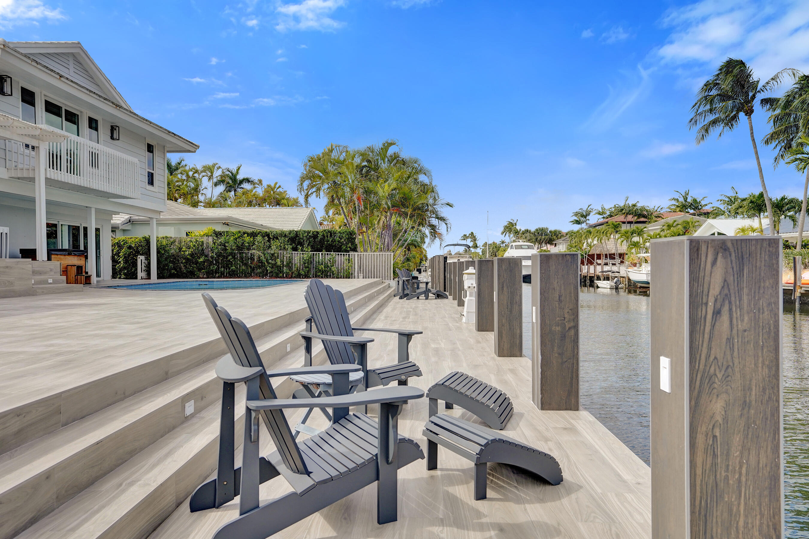 3001 Northeast 47th Street Lighthouse Point, FL 33064 - Photo 33 of 39 a view of a patio with a table and chairs