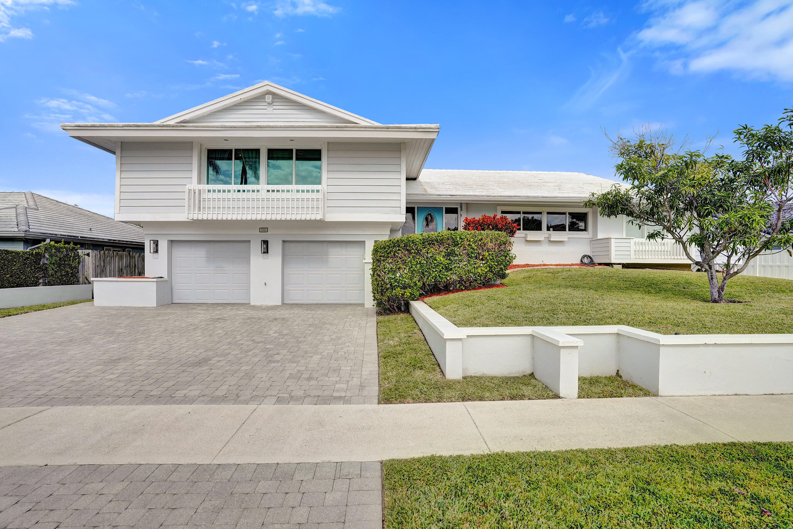 3001 Northeast 47th Street Lighthouse Point, FL 33064 - Photo 37 of 39 a front view of a house with a yard