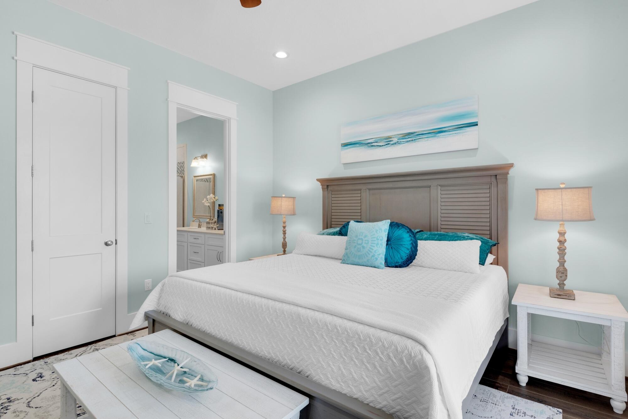 4563 Luke Avenue Destin, FL 32541 - Photo 13 of 37 a bedroom with a bed and a lamp on dresser