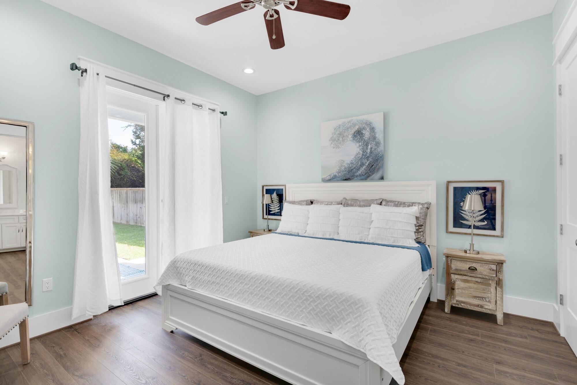 4563 Luke Avenue Destin, FL 32541 - Photo 16 of 37 a bedroom with a bed and a window
