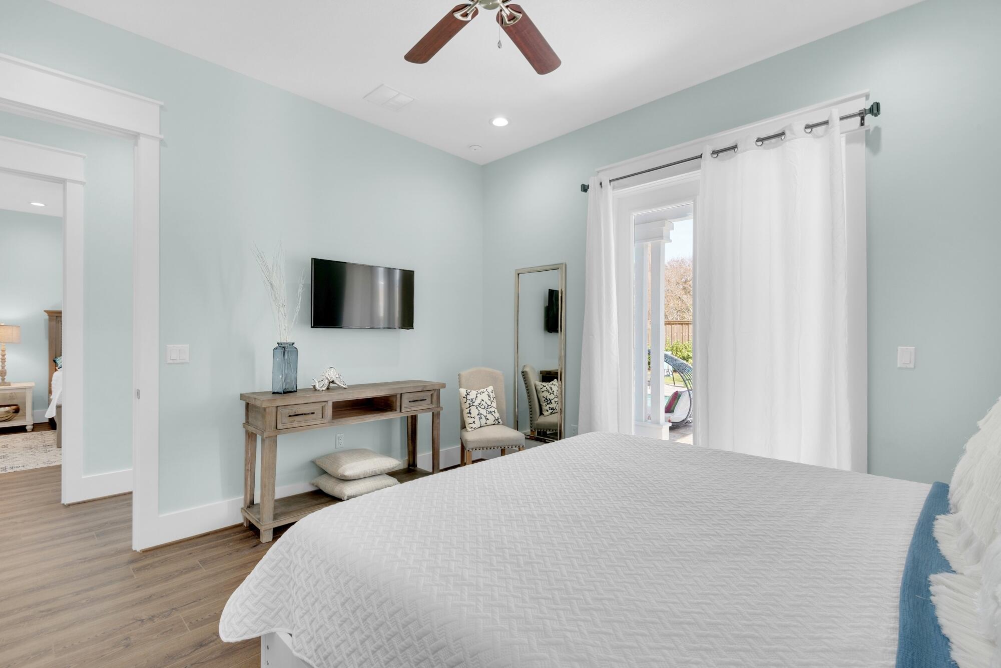 4563 Luke Avenue Destin, FL 32541 - Photo 17 of 37 a bedroom with a bed and a flat tv screen