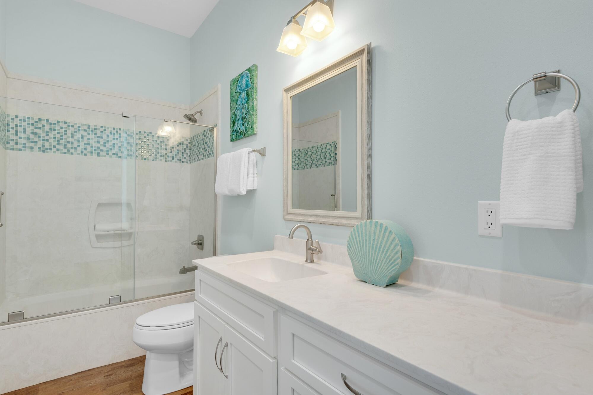 4563 Luke Avenue Destin, FL 32541 - Photo 22 of 37 a bathroom with a toilet sink and shower