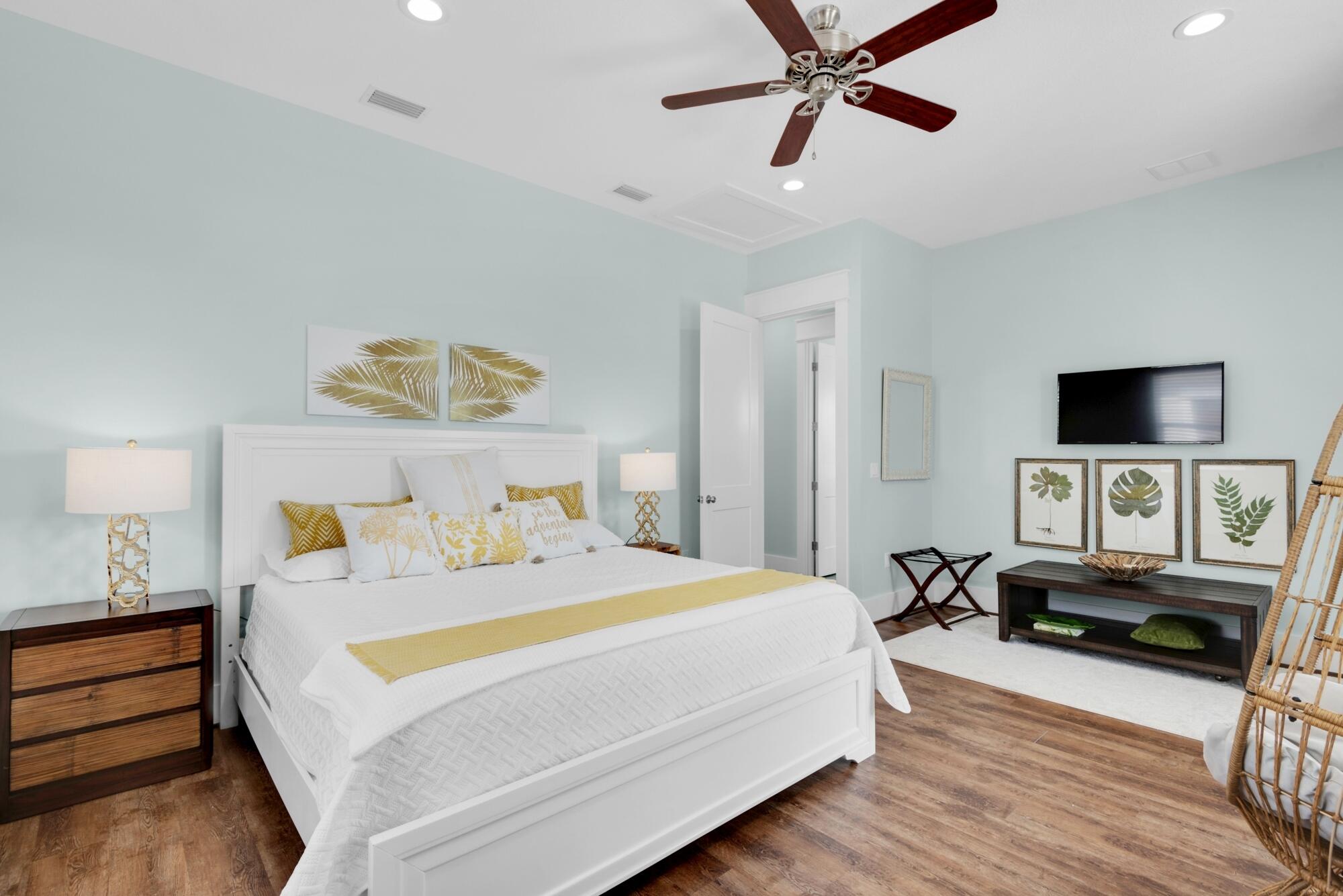 4563 Luke Avenue Destin, FL 32541 - Photo 23 of 37 a bedroom with a bed and wooden floor