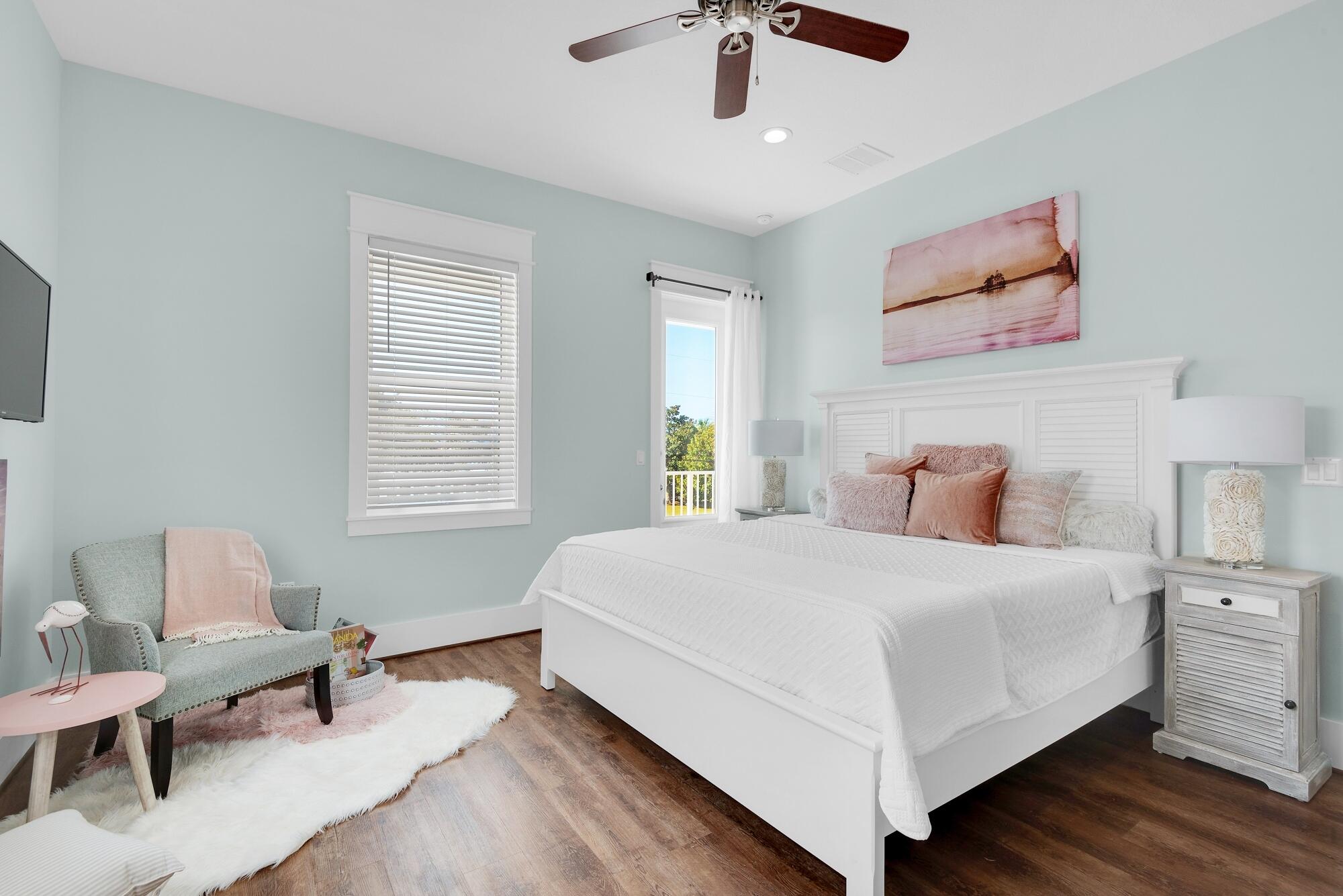 4563 Luke Avenue Destin, FL 32541 - Photo 25 of 37 a bedroom with a bed and a chair