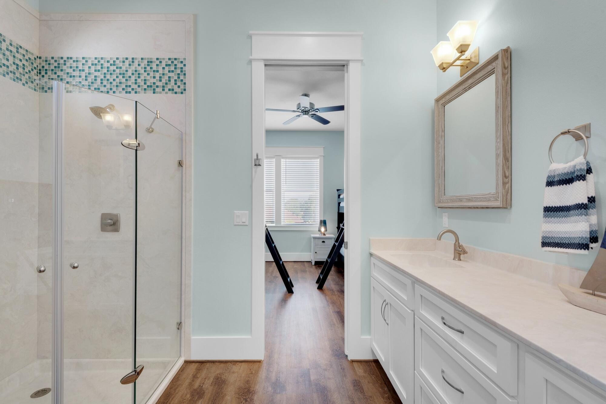 4563 Luke Avenue Destin, FL 32541 - Photo 29 of 37 a bathroom with a double vanity sink and a mirror