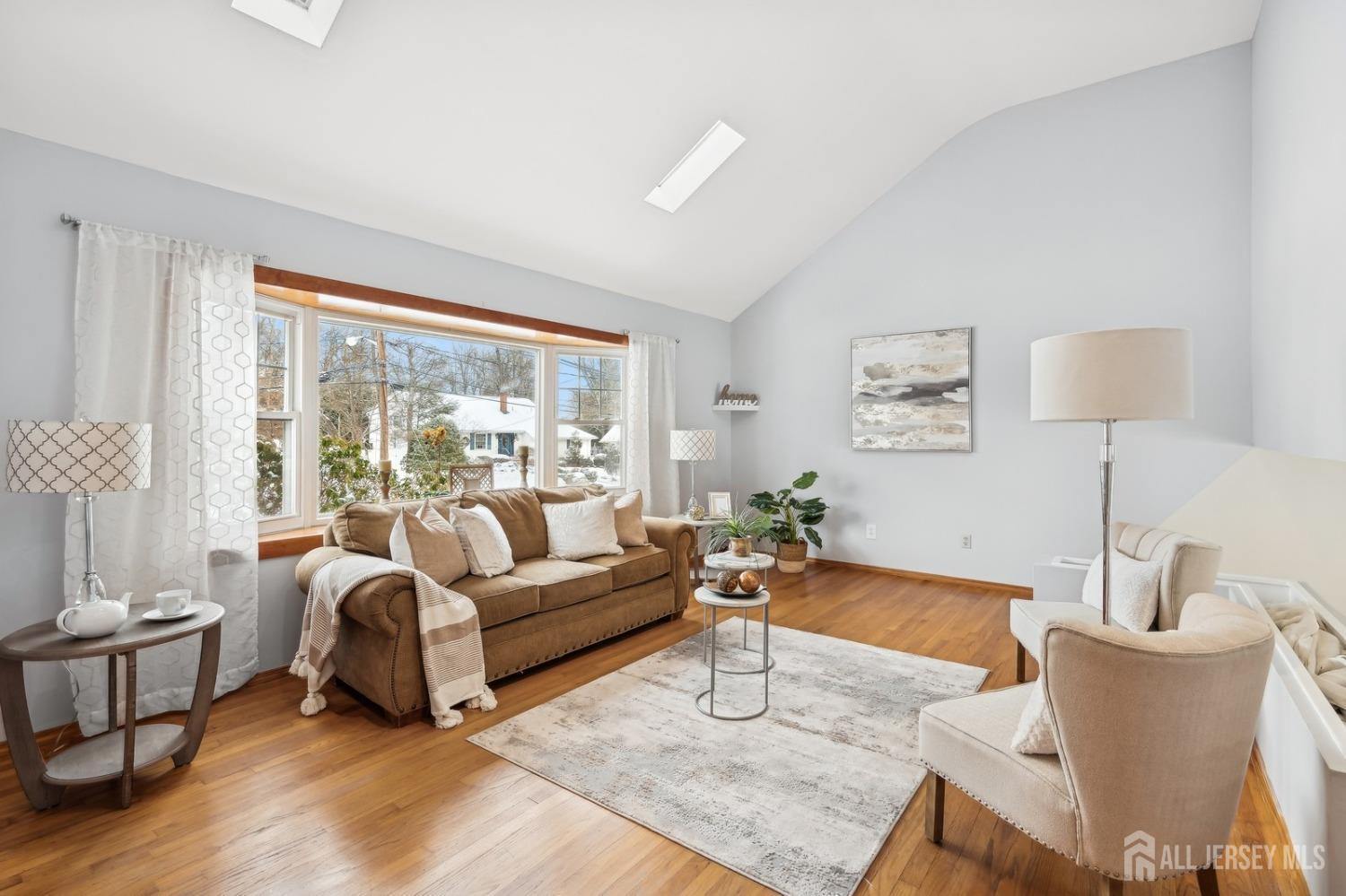 12 Midland Road Edison, NJ 08820 - Photo 2 of 7 a living room with furniture and a large window