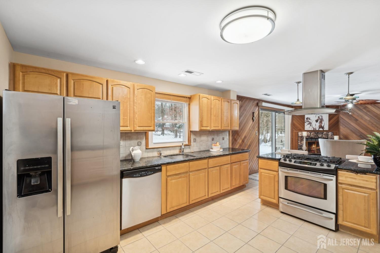 12 Midland Road Edison, NJ 08820 - Photo 4 of 7 a kitchen with stainless steel appliances a refrigerator sink and stove