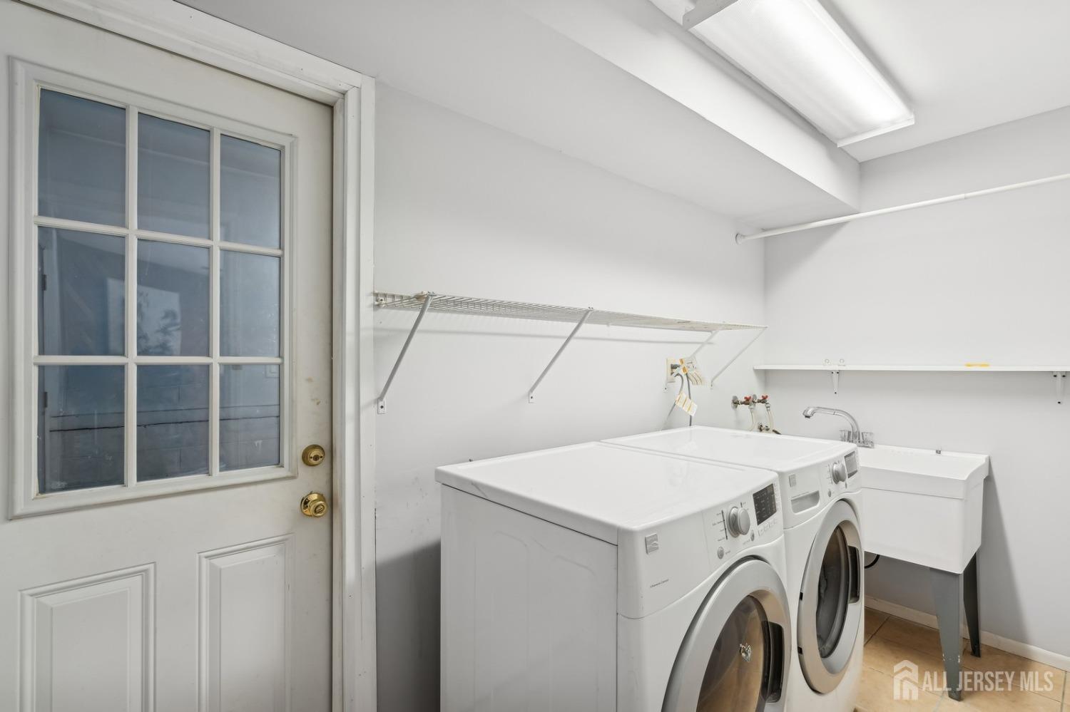 12 Midland Road Edison, NJ 08820 - Photo 7 of 7 a utility room with dryer and washer