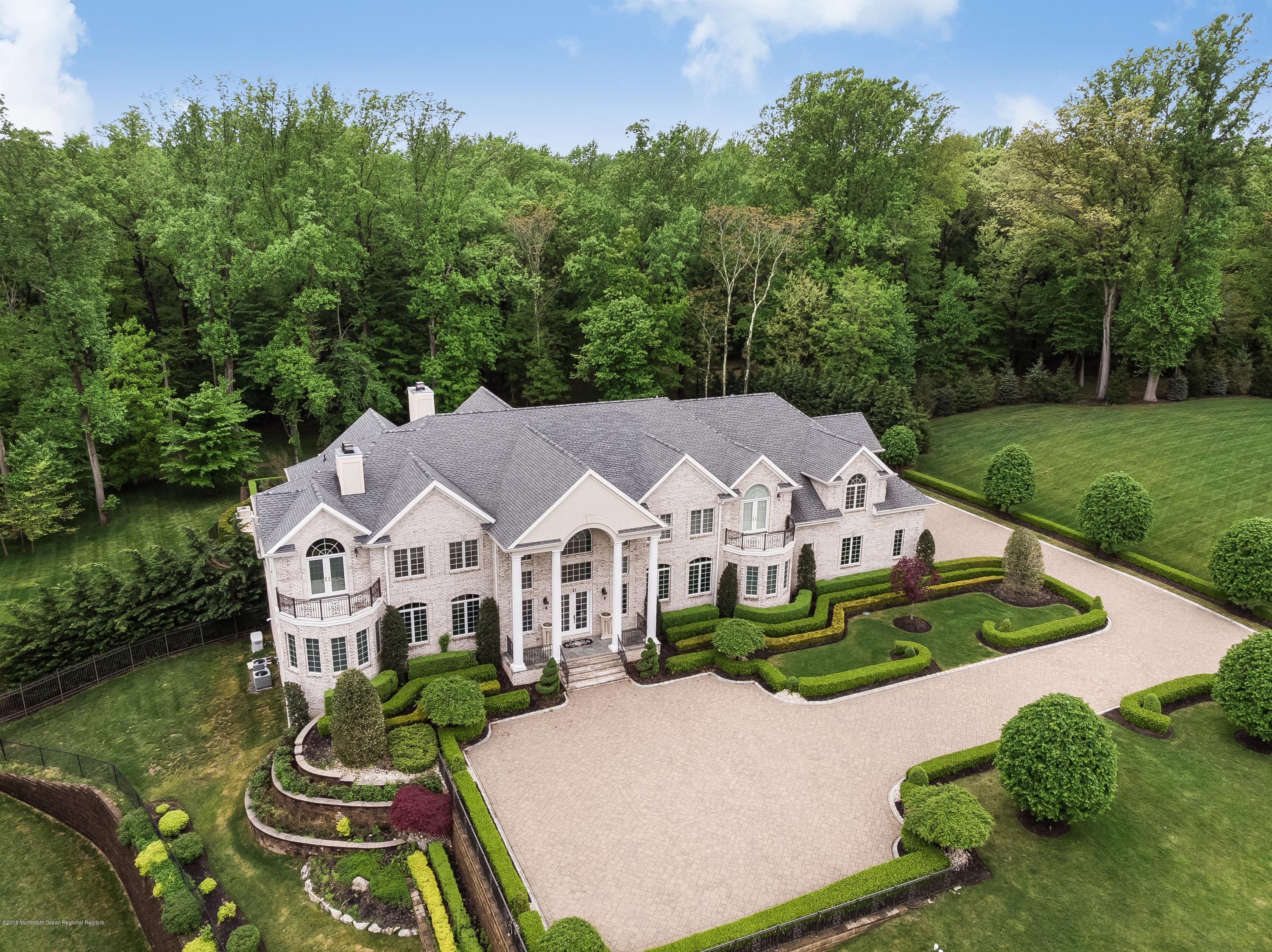 21 Embry Farm Road Marlboro, NJ 07746 - Photo 1 of 68 an aerial view of residential houses with outdoor space and trees