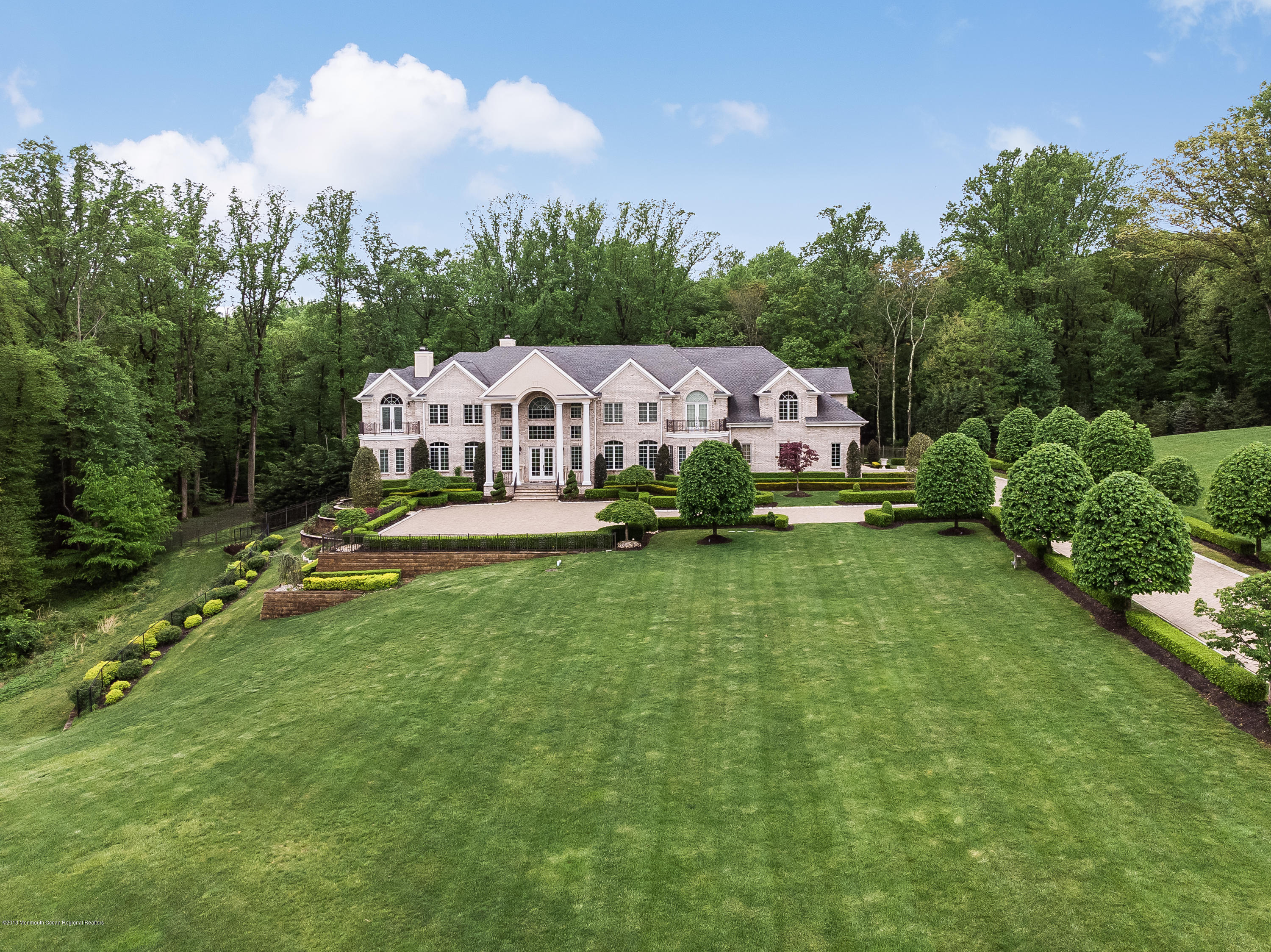 21 Embry Farm Road Marlboro, NJ 07746 - Photo 2 of 68 a aerial view of a house with swimming pool garden view and trees