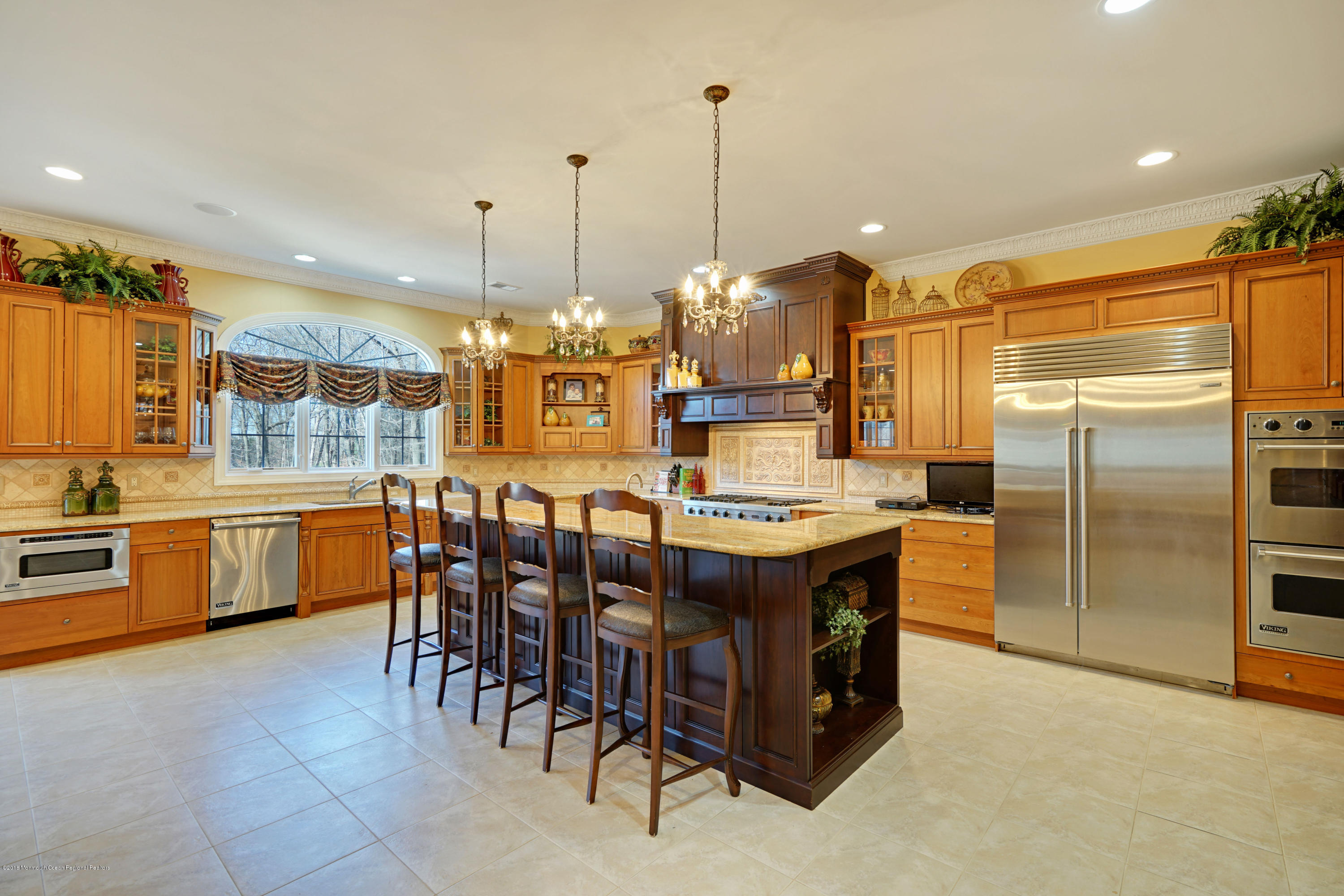 21 Embry Farm Road Marlboro, NJ 07746 - Photo 19 of 68 a kitchen with kitchen island a counter top space appliances and a chandelier