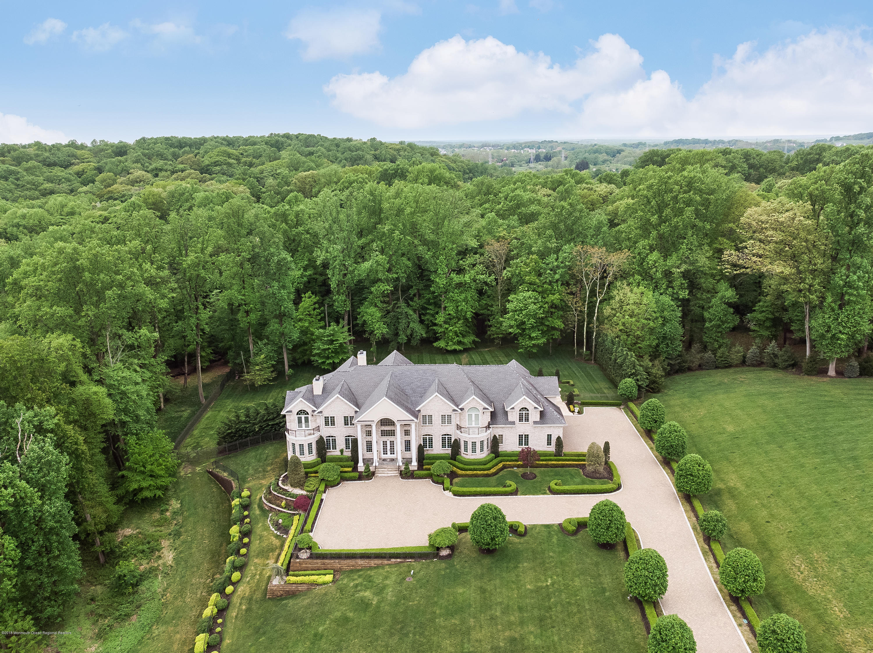 21 Embry Farm Road Marlboro, NJ 07746 - Photo 3 of 68 an aerial view of a house with pool big yard and large trees