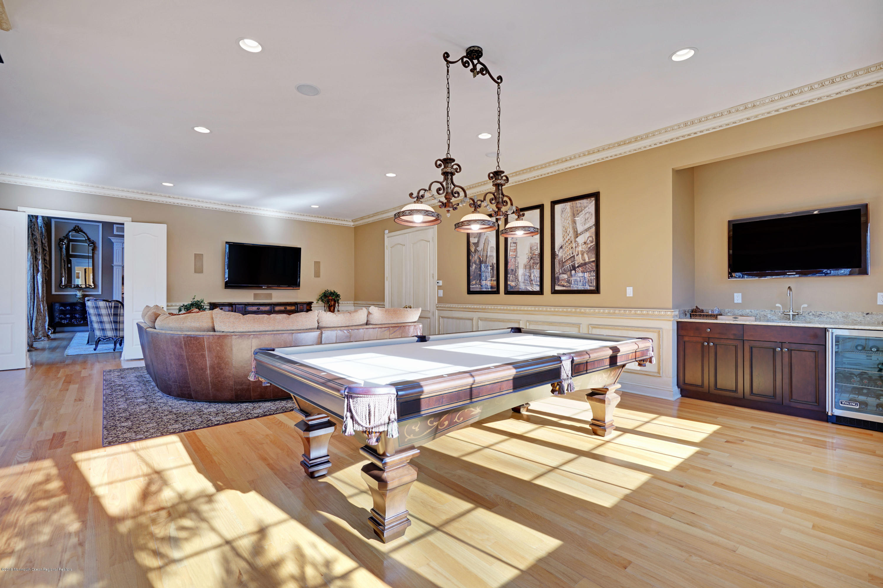 21 Embry Farm Road Marlboro, NJ 07746 - Photo 27 of 68 a living room with furniture a flat screen tv and kitchen view