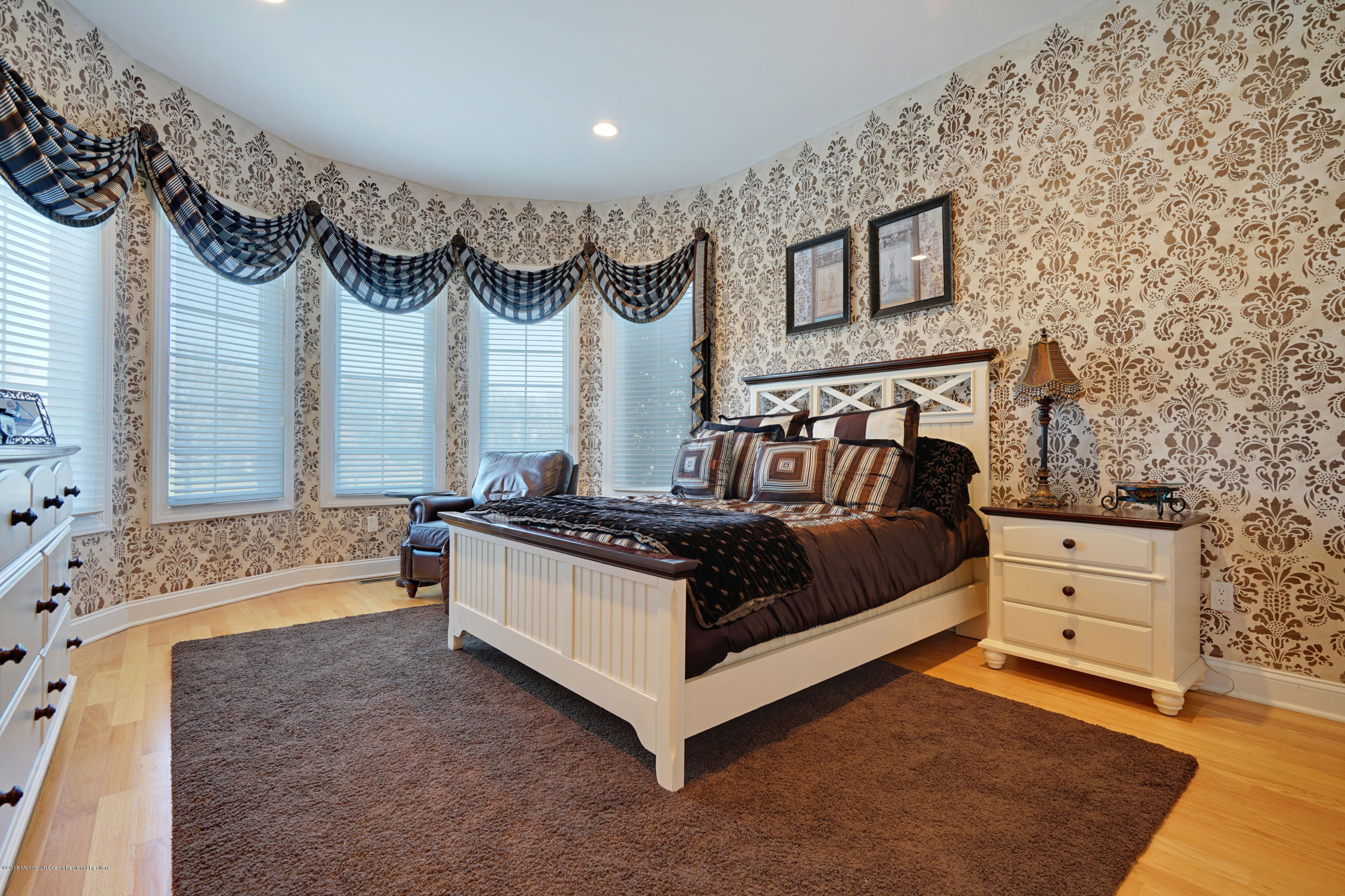 21 Embry Farm Road Marlboro, NJ 07746 - Photo 33 of 68 a spacious bedroom with a bed and a chandelier
