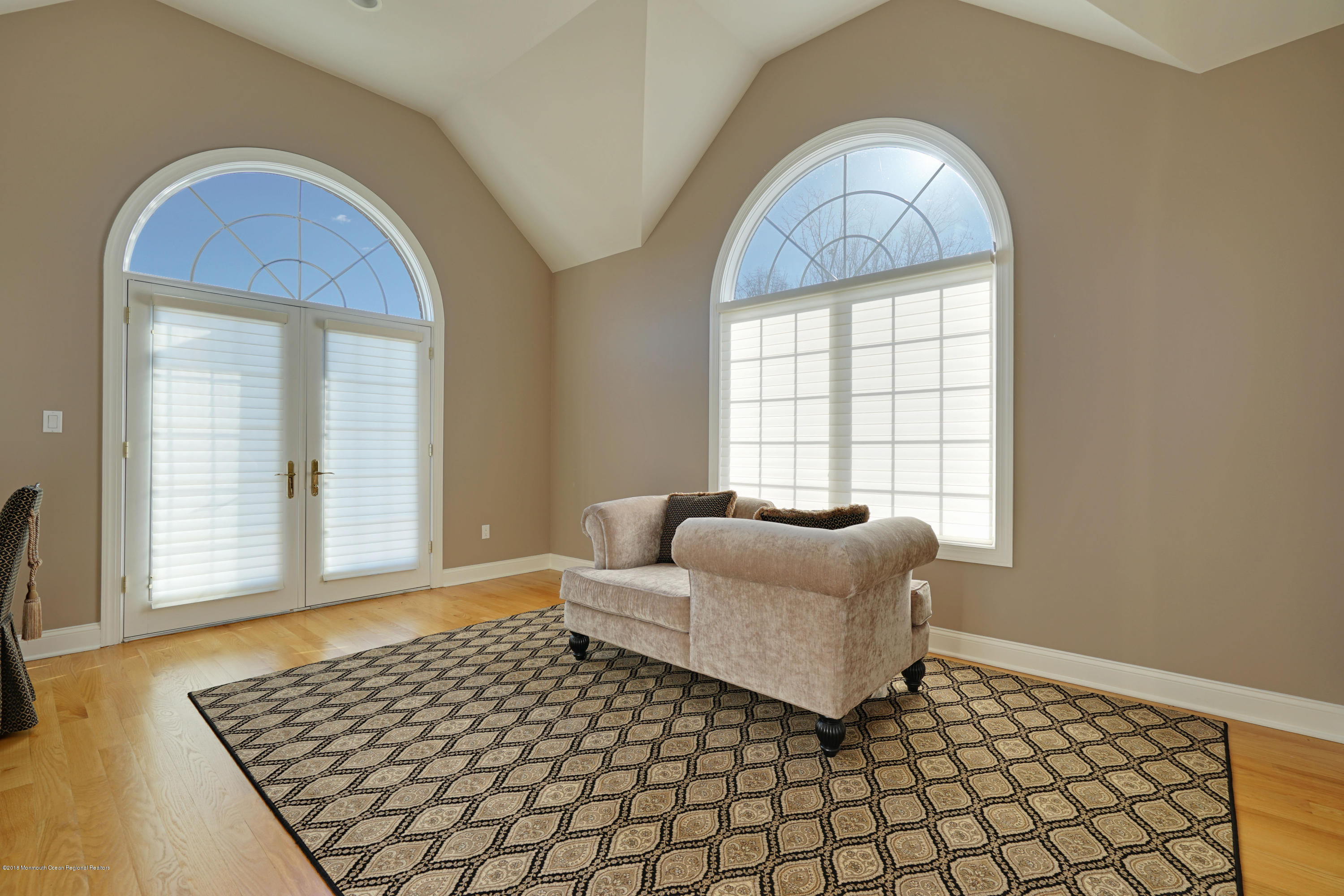 21 Embry Farm Road Marlboro, NJ 07746 - Photo 40 of 68 a living room with a couch and a table
