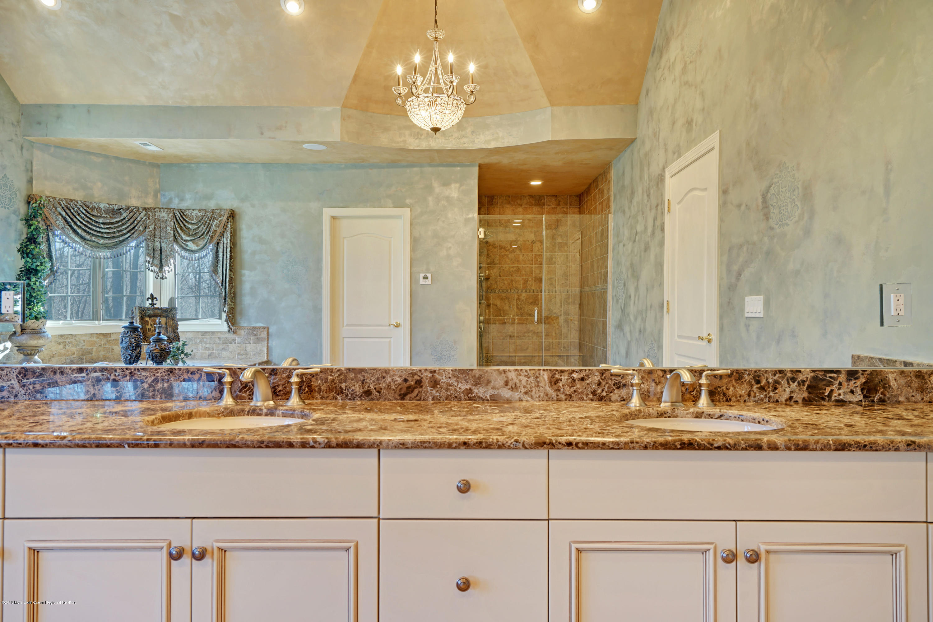 21 Embry Farm Road Marlboro, NJ 07746 - Photo 43 of 68 a bathroom with a sink and a mirror