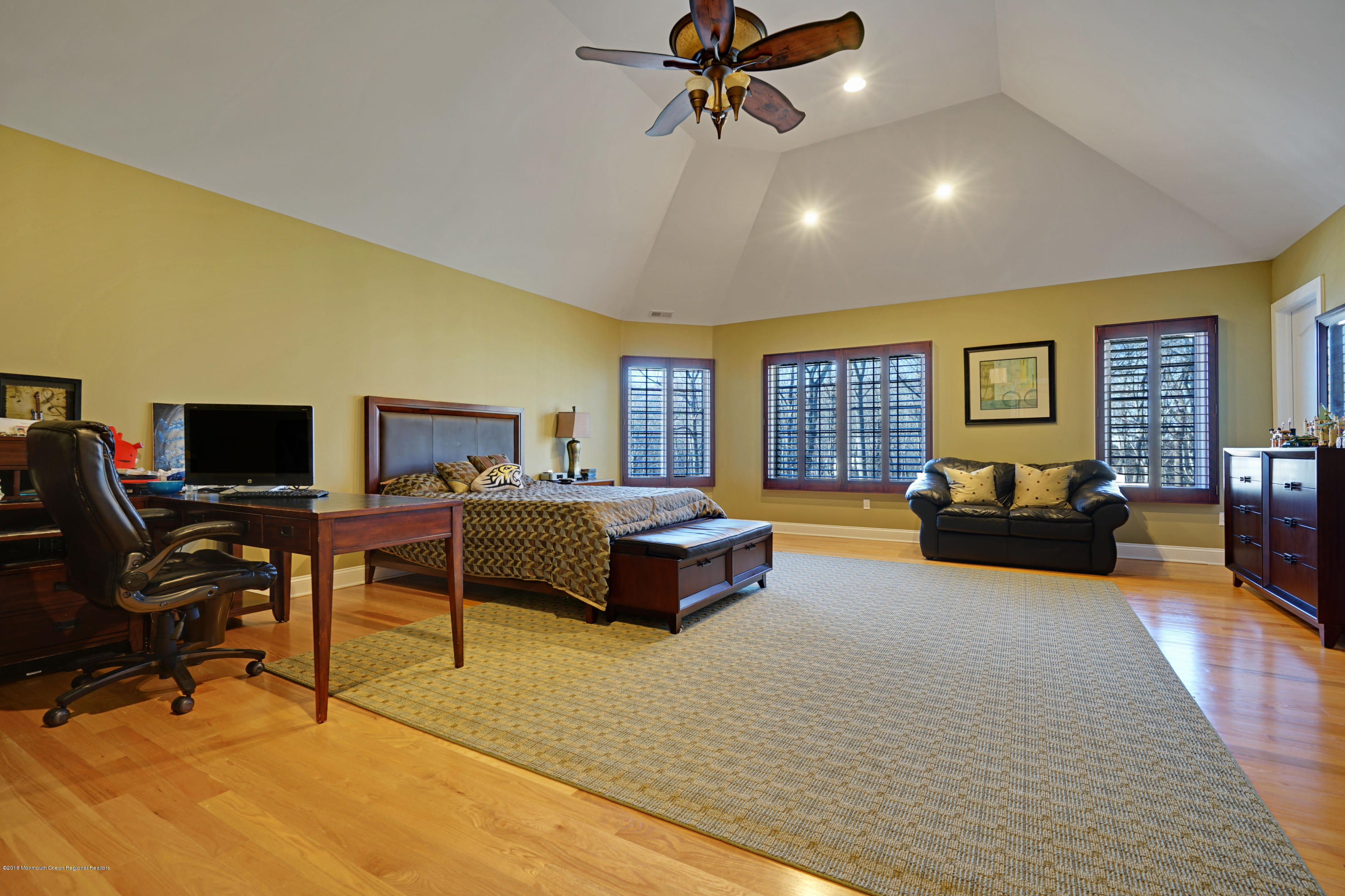 21 Embry Farm Road Marlboro, NJ 07746 - Photo 45 of 68 a spacious bedroom with a large bed and a couch