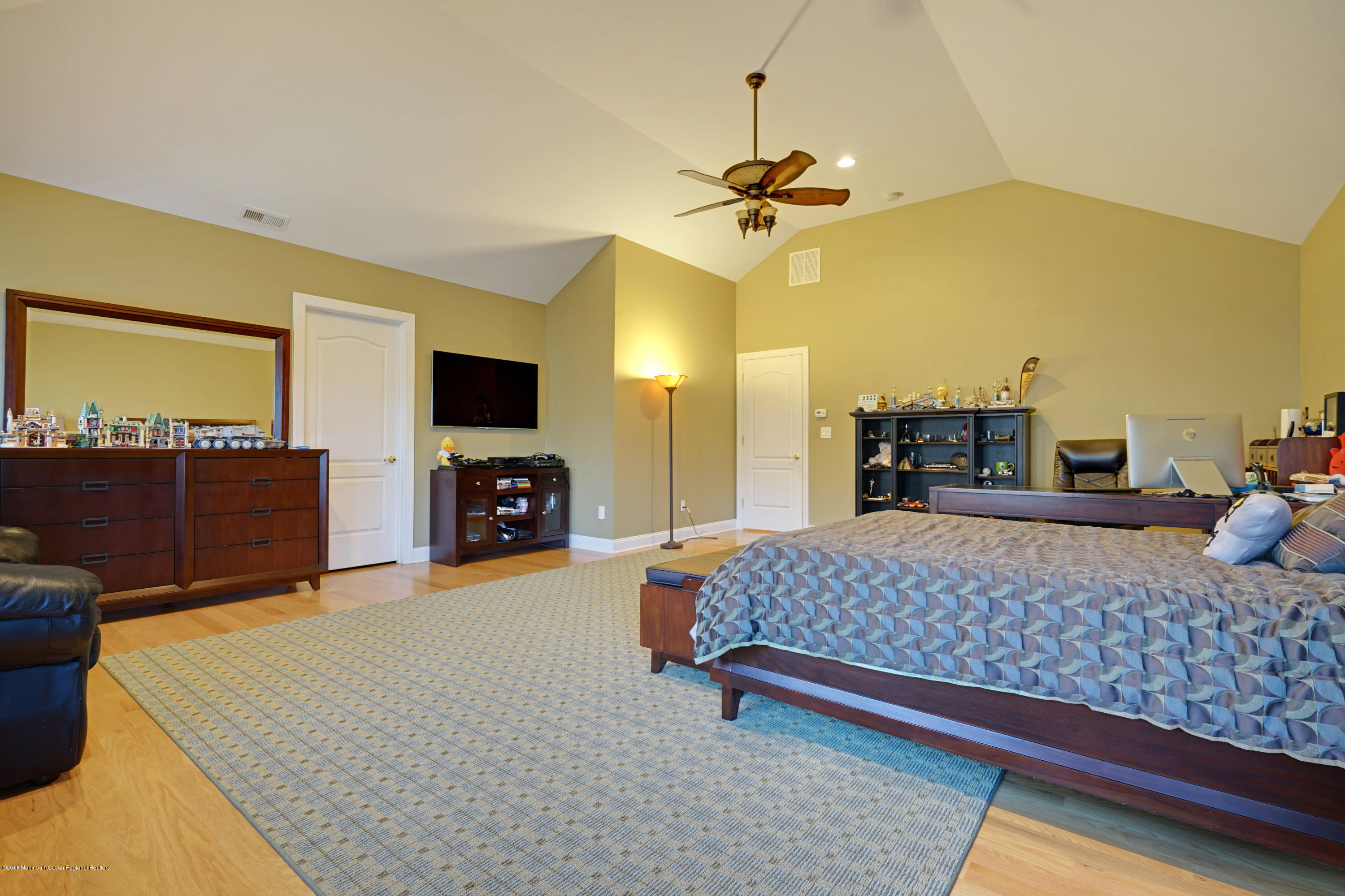 21 Embry Farm Road Marlboro, NJ 07746 - Photo 46 of 68 a bedroom with a bed and flat screen tv