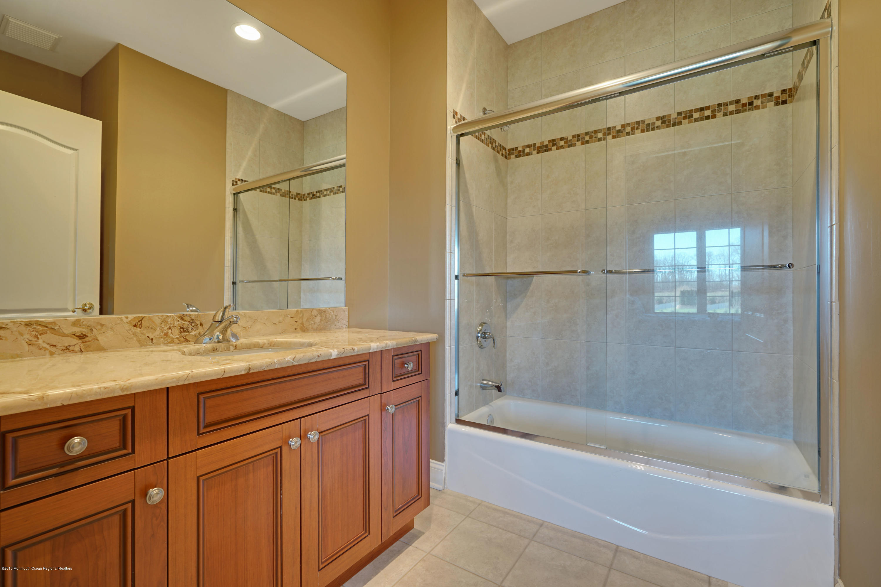21 Embry Farm Road Marlboro, NJ 07746 - Photo 47 of 68 a bathroom with a granite countertop shower sink and mirror