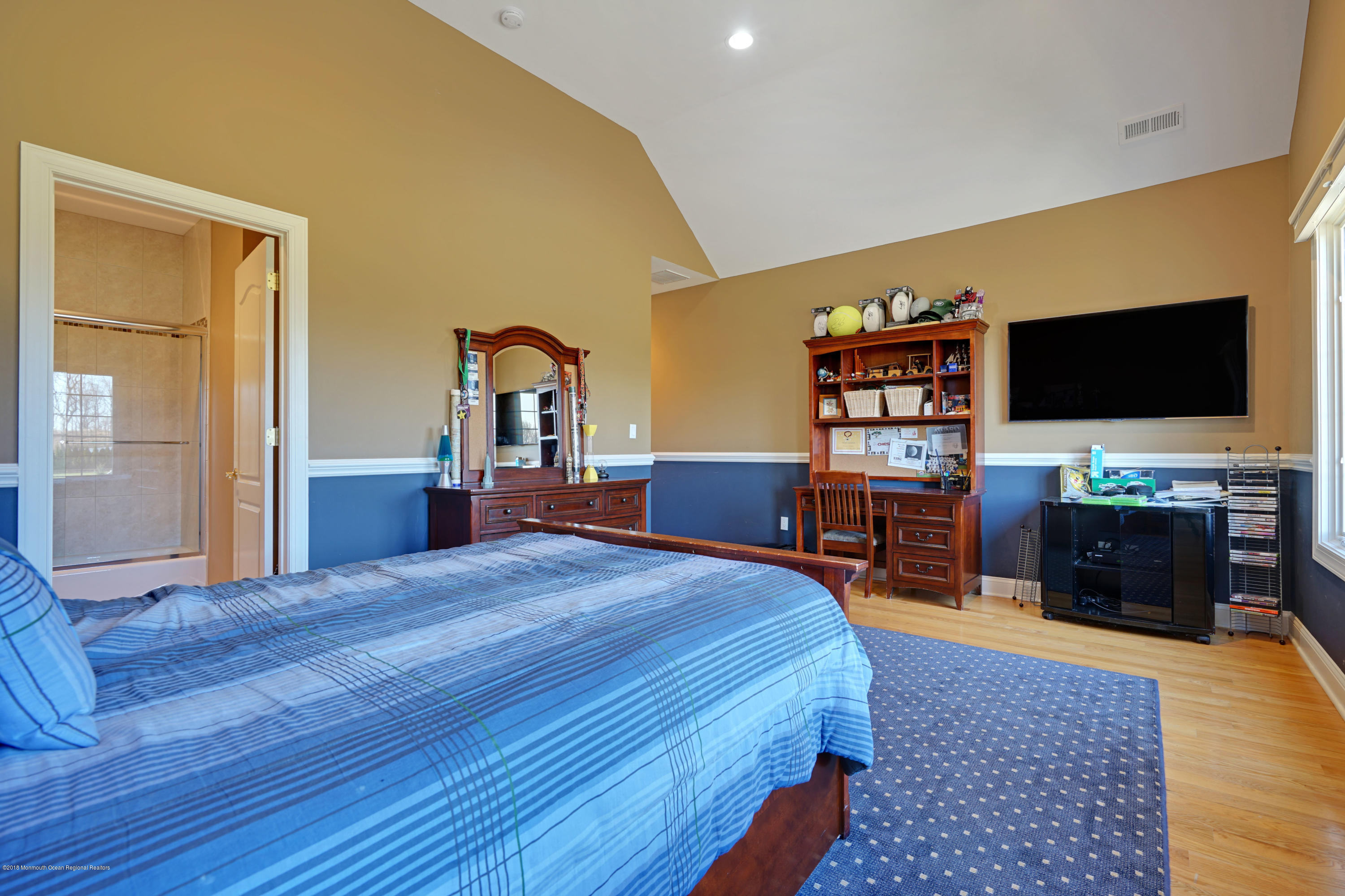 21 Embry Farm Road Marlboro, NJ 07746 - Photo 49 of 68 a bedroom with a bed and a flat screen tv