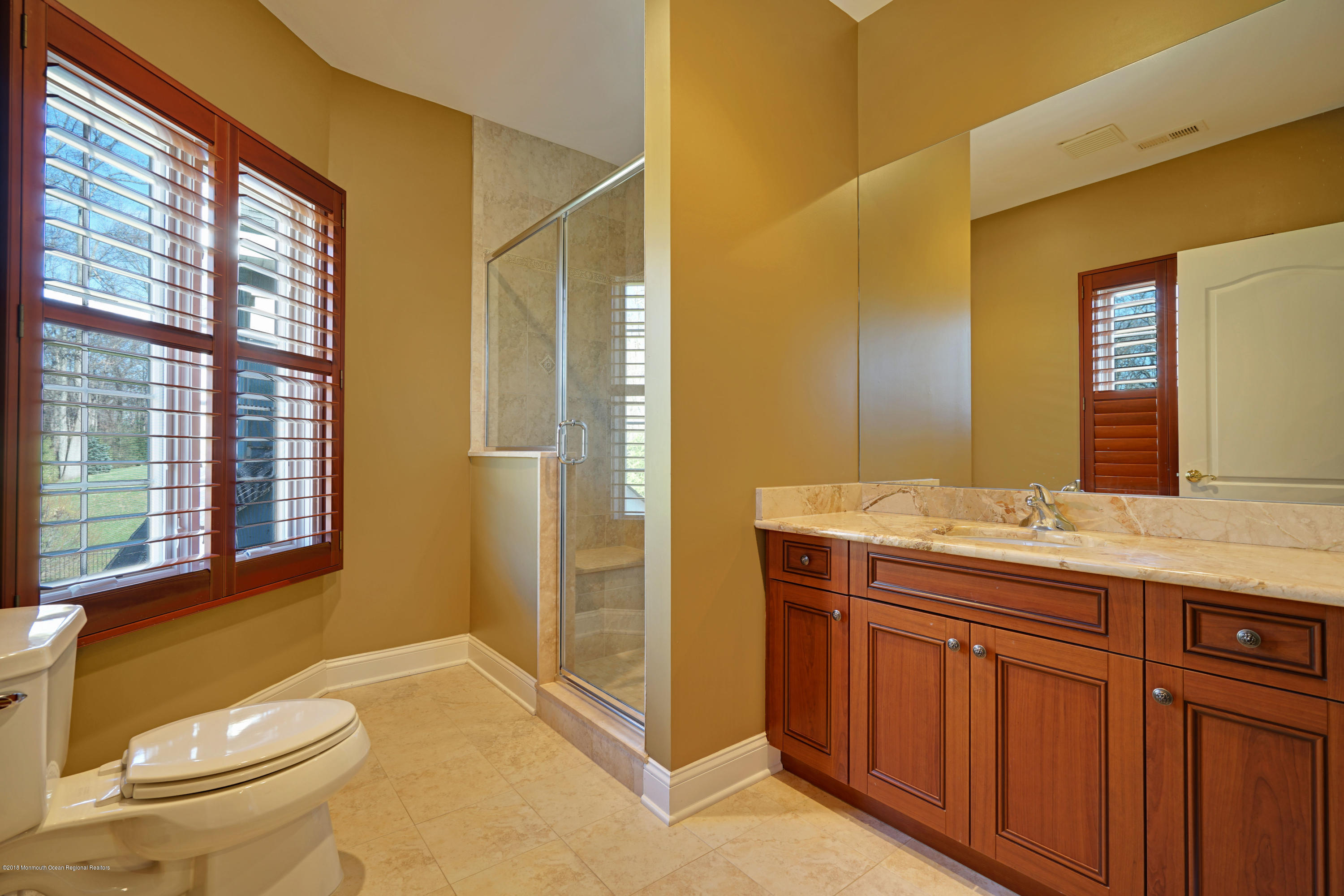 21 Embry Farm Road Marlboro, NJ 07746 - Photo 50 of 68 a bathroom with a granite countertop sink toilet and shower