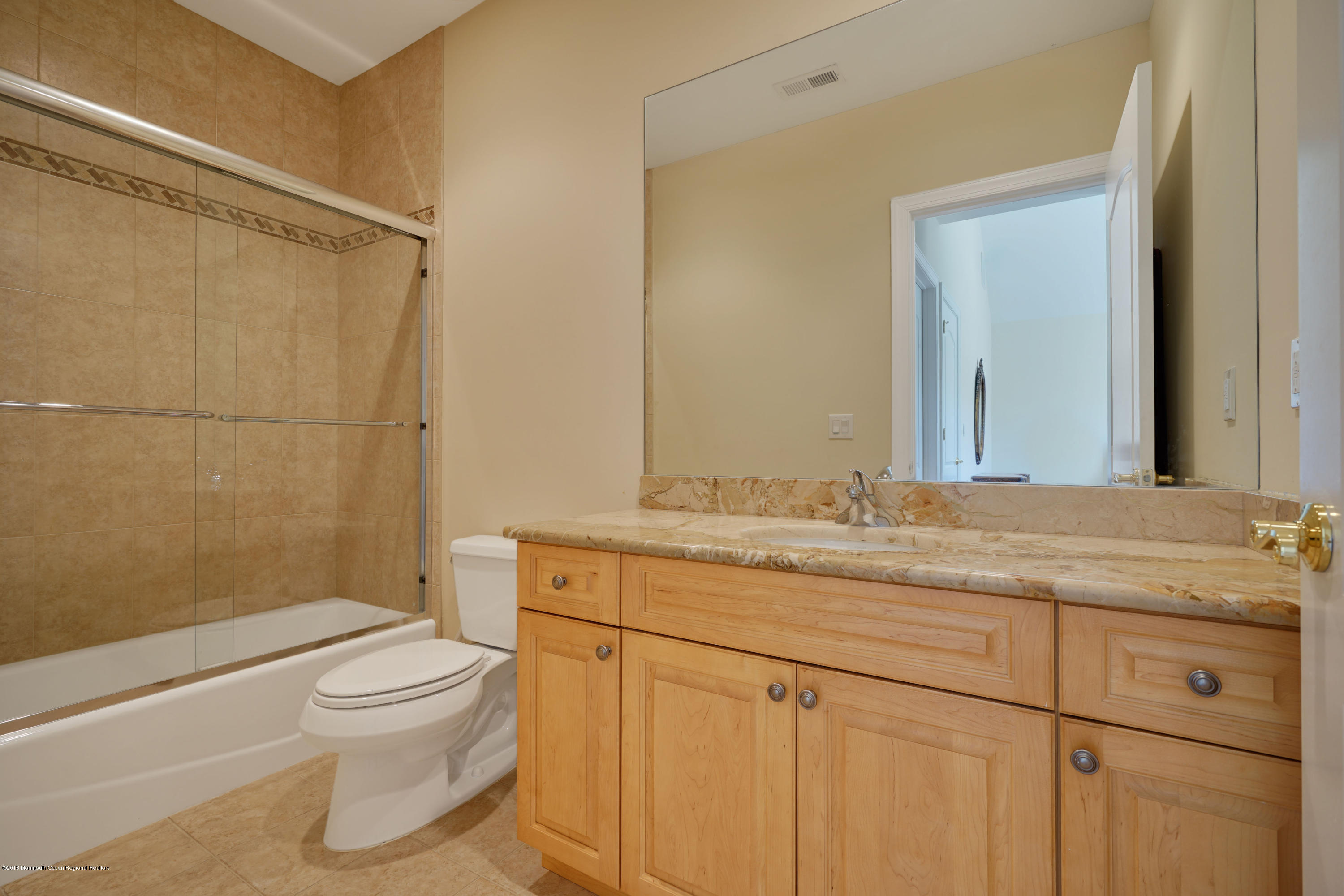 21 Embry Farm Road Marlboro, NJ 07746 - Photo 53 of 68 a bathroom with a granite countertop sink a toilet and shower