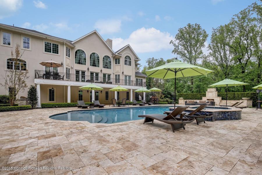 21 Embry Farm Road Marlboro, NJ 07746 - Photo 58 of 68 a view of a house with backyard and sitting area