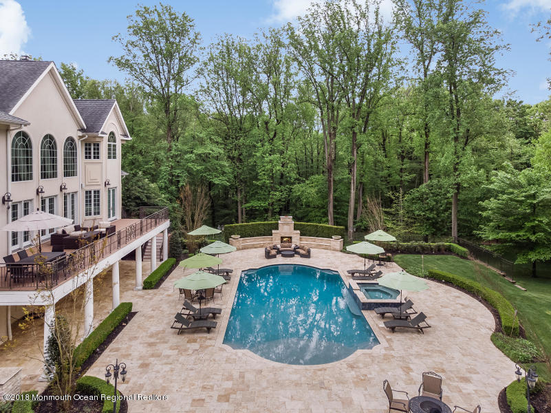 21 Embry Farm Road Marlboro, NJ 07746 - Photo 66 of 68 a view of a house with backyard and sitting area