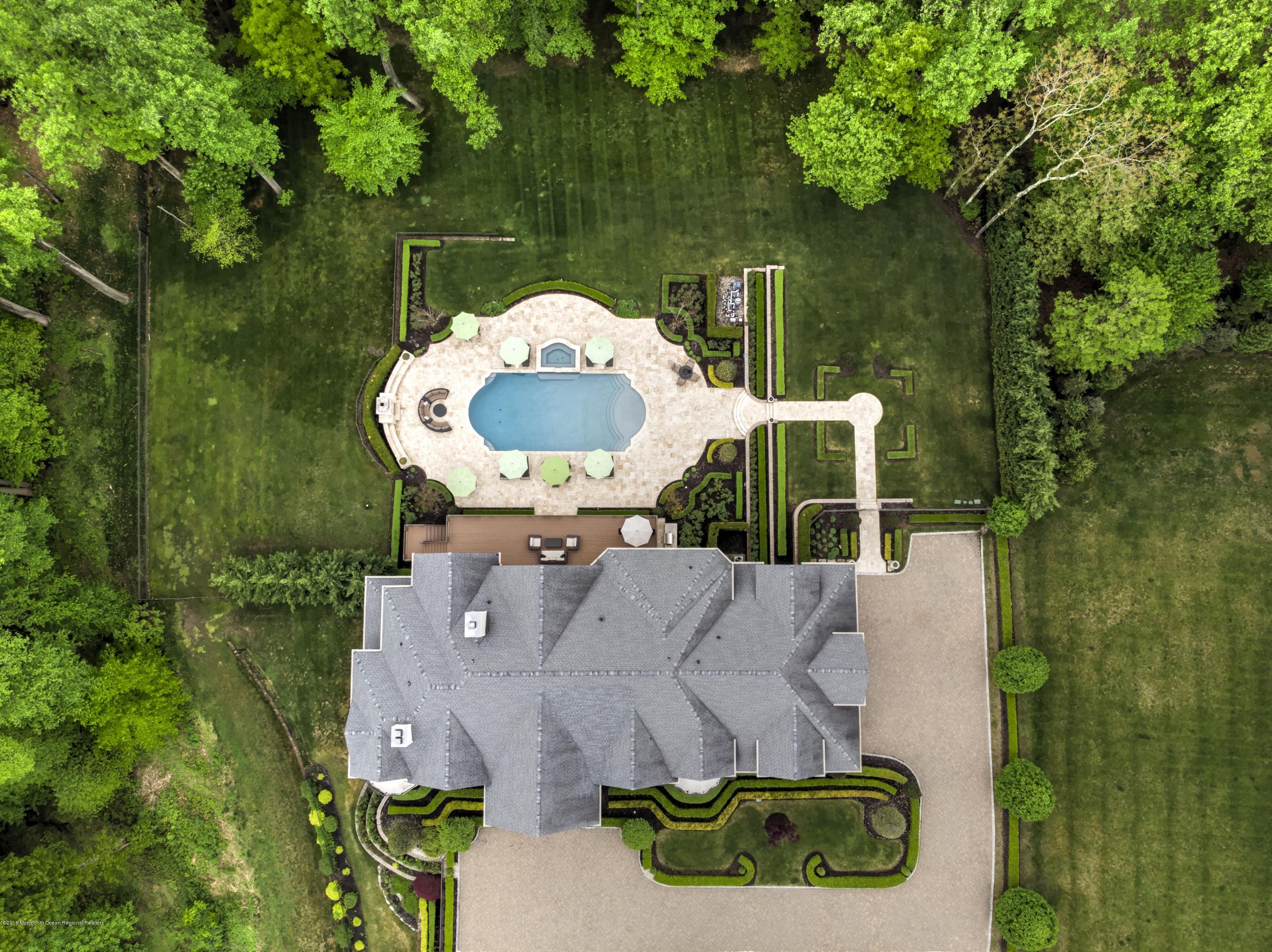 21 Embry Farm Road Marlboro, NJ 07746 - Photo 68 of 68 an aerial view of a house with a yard
