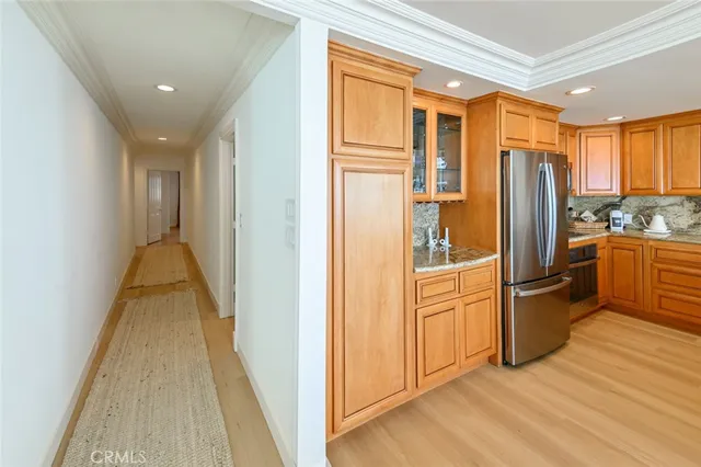 a view of a kitchen with a refrigerator