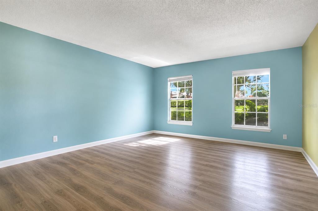412 Forest Street Windermere, FL 34786 - Photo 7 of 34 an empty room with wooden floor and windows