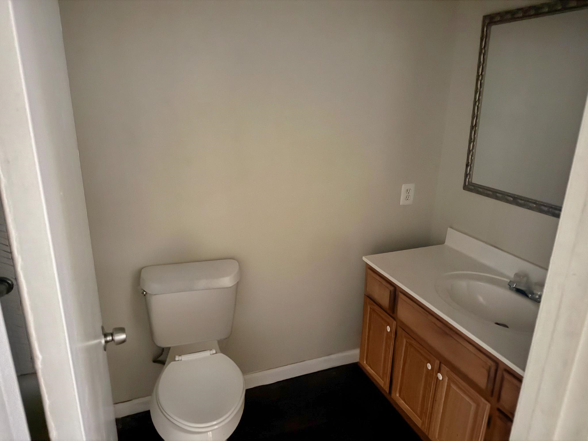 4178 Crain Road Memphis, TN 38128 - Photo 8 of 8 Bathroom featuring a wood-finish vanity with an integrated sink and a framed mirror