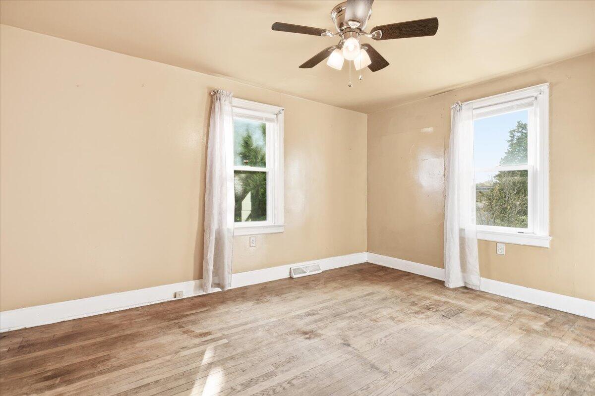 519 Bruffey Street Salem, VA 24153 - Photo 11 of 26 an empty room with windows and fan