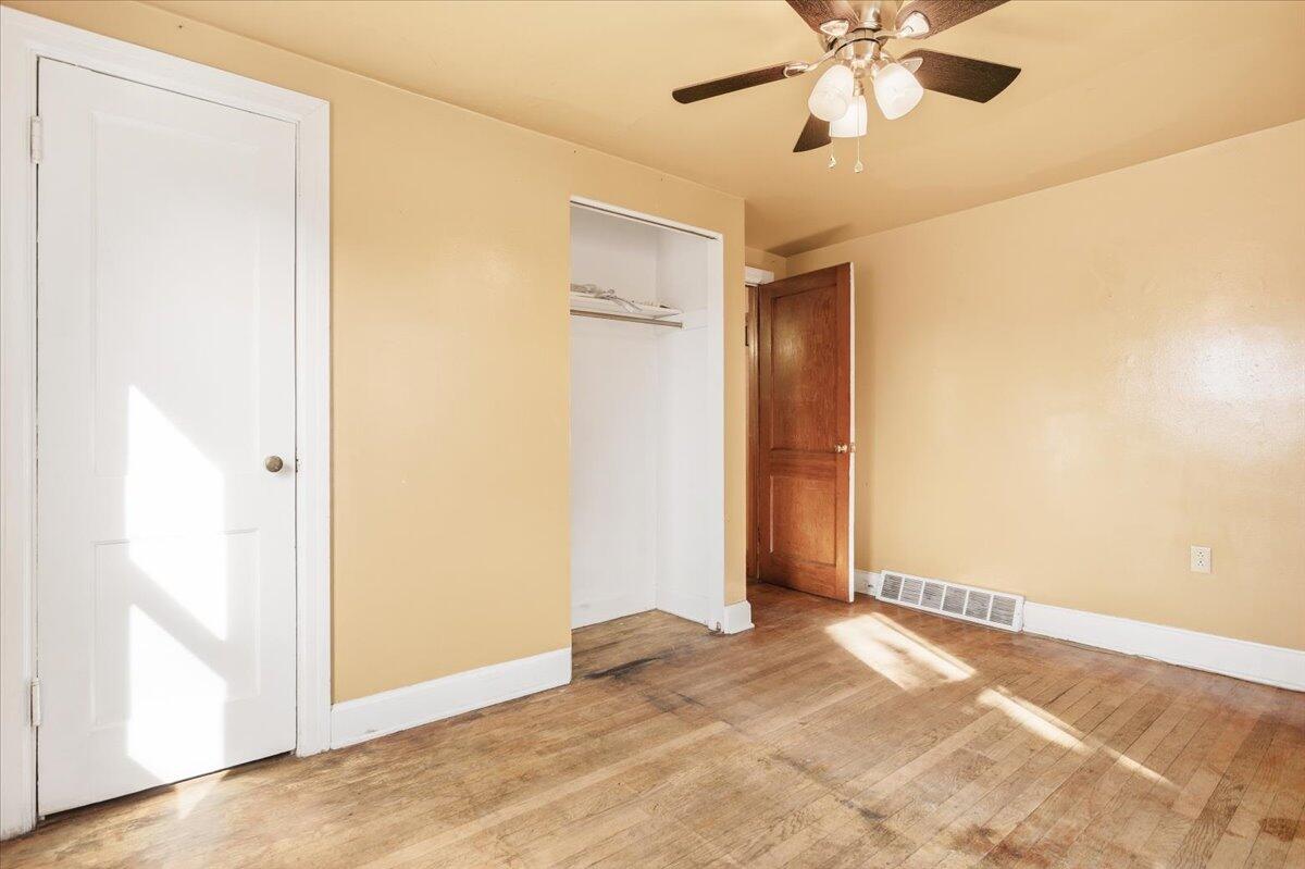 519 Bruffey Street Salem, VA 24153 - Photo 12 of 26 an empty room with closet and a chandelier fan