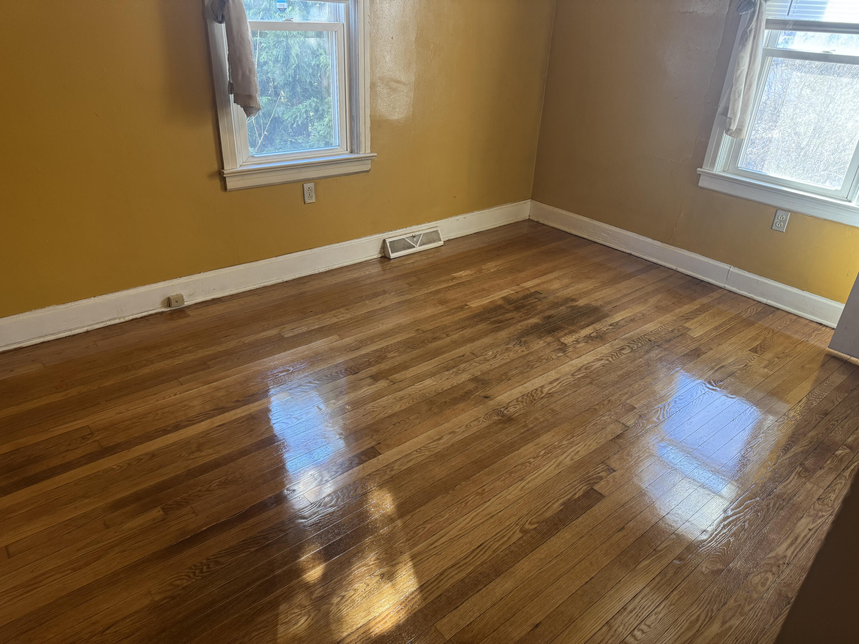 519 Bruffey Street Salem, VA 24153 - Photo 24 of 26 a view of an empty room with wooden floor and a window