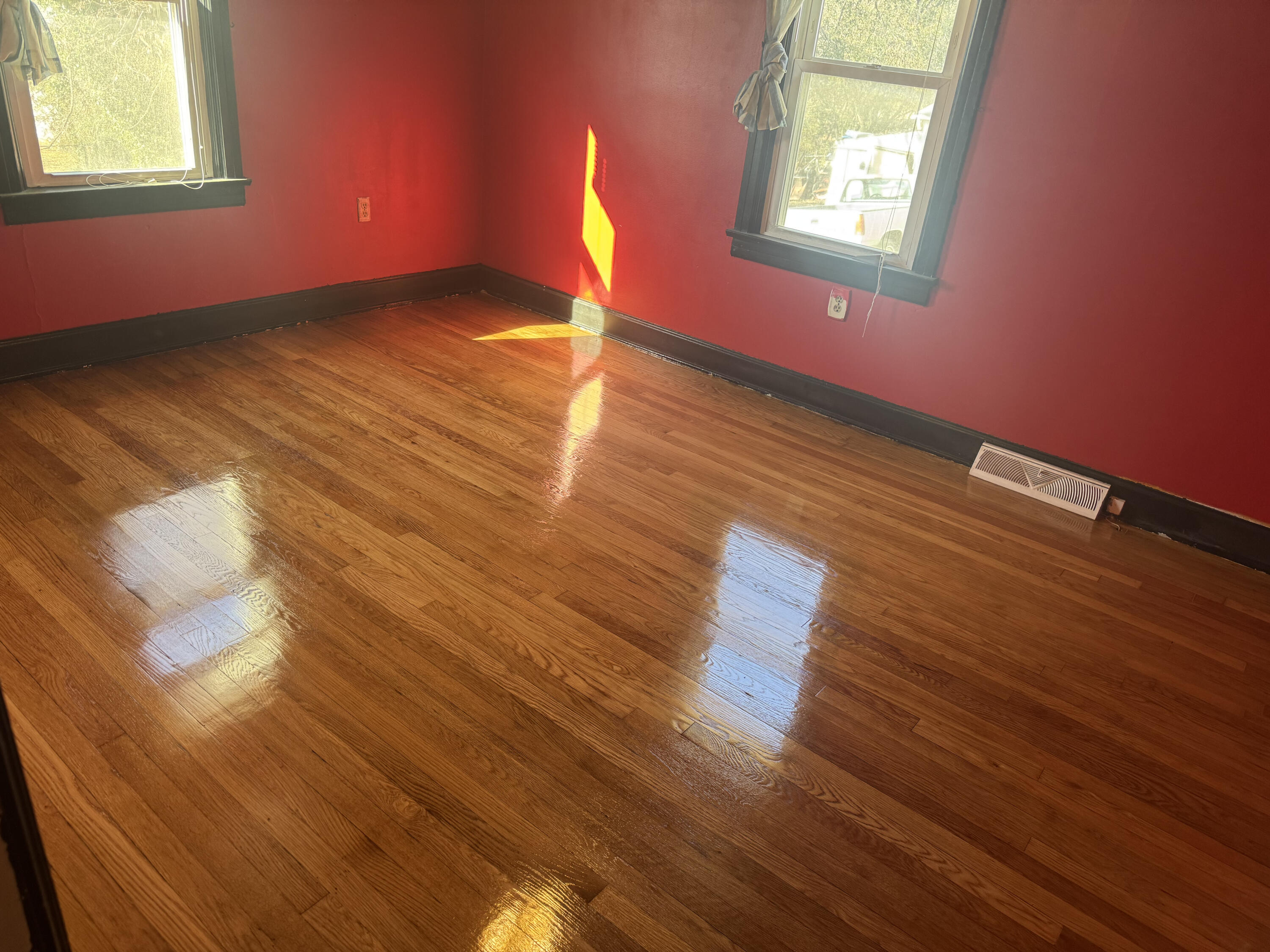 519 Bruffey Street Salem, VA 24153 - Photo 26 of 26 a view of an empty room with wooden floor and a window