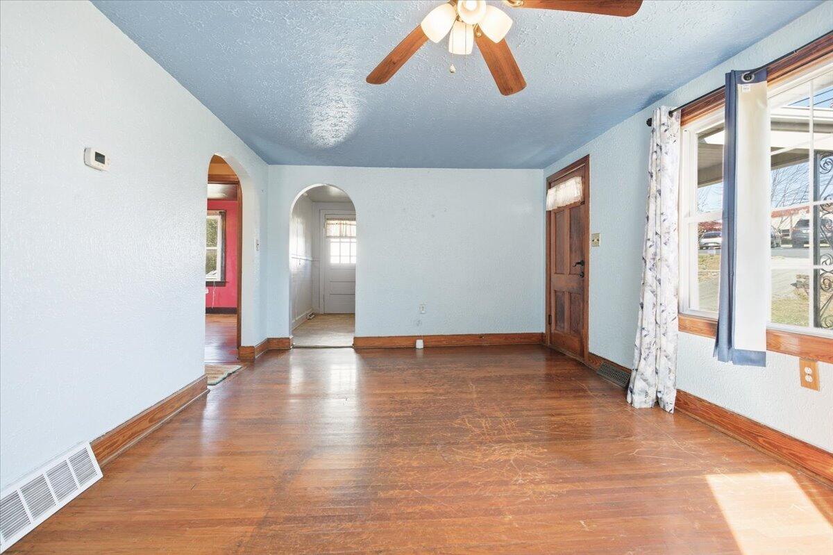 519 Bruffey Street Salem, VA 24153 - Photo 7 of 26 a view of an empty room with window and wooden floor