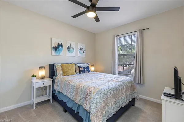 a bedroom with furniture and a window